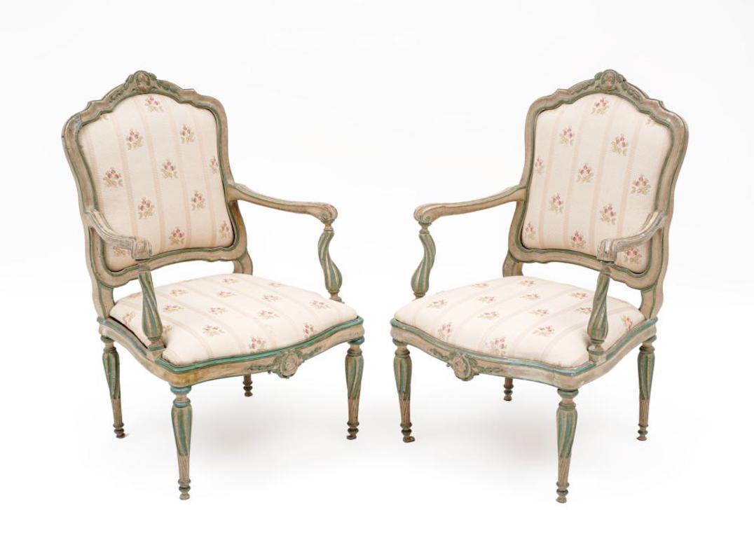 Pair of 18th century Italian painted and carved neoclassical armchairs

Carved and paint decorated all over, top rail with center profile bust medallion, serpentine arms, twist arm supports. Conforming skirt and legs, floral patterned upholstery,