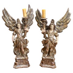 Pair of 18th Century Italian Carved and Polychrome Angel Candlesticks.