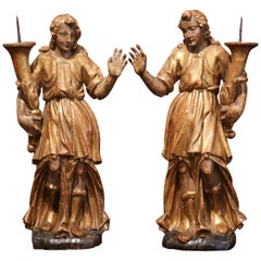 Paire de statues d'anges en bois doré sculpté et polychrome du XVIIIe siècle en Italie