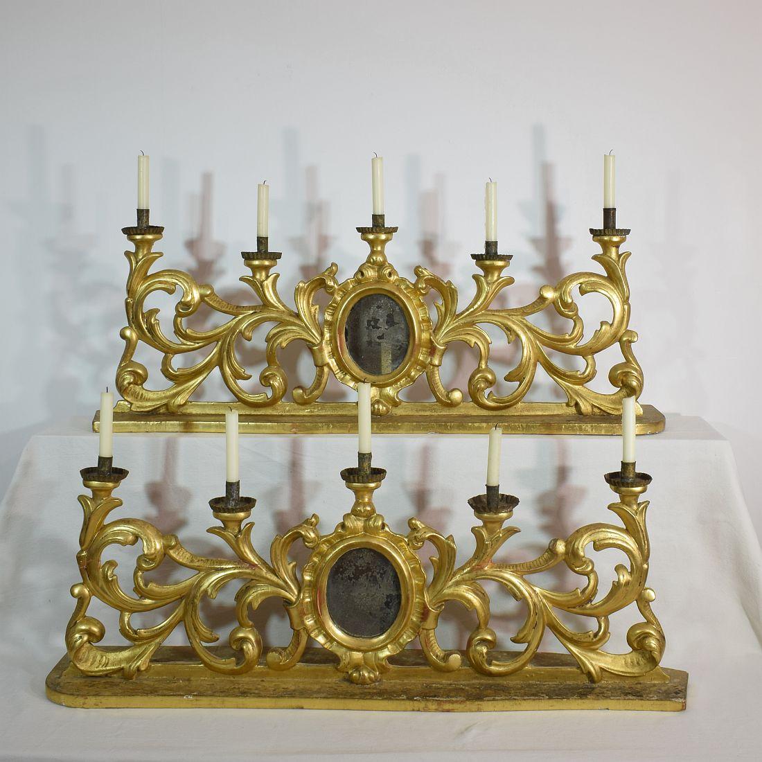 Unique Baroque giltwood candleholders for in total 10 candles, Italy, circa 1750-1780. Weathered, repairs and losses.
More pictures available on request. Measurement individual.