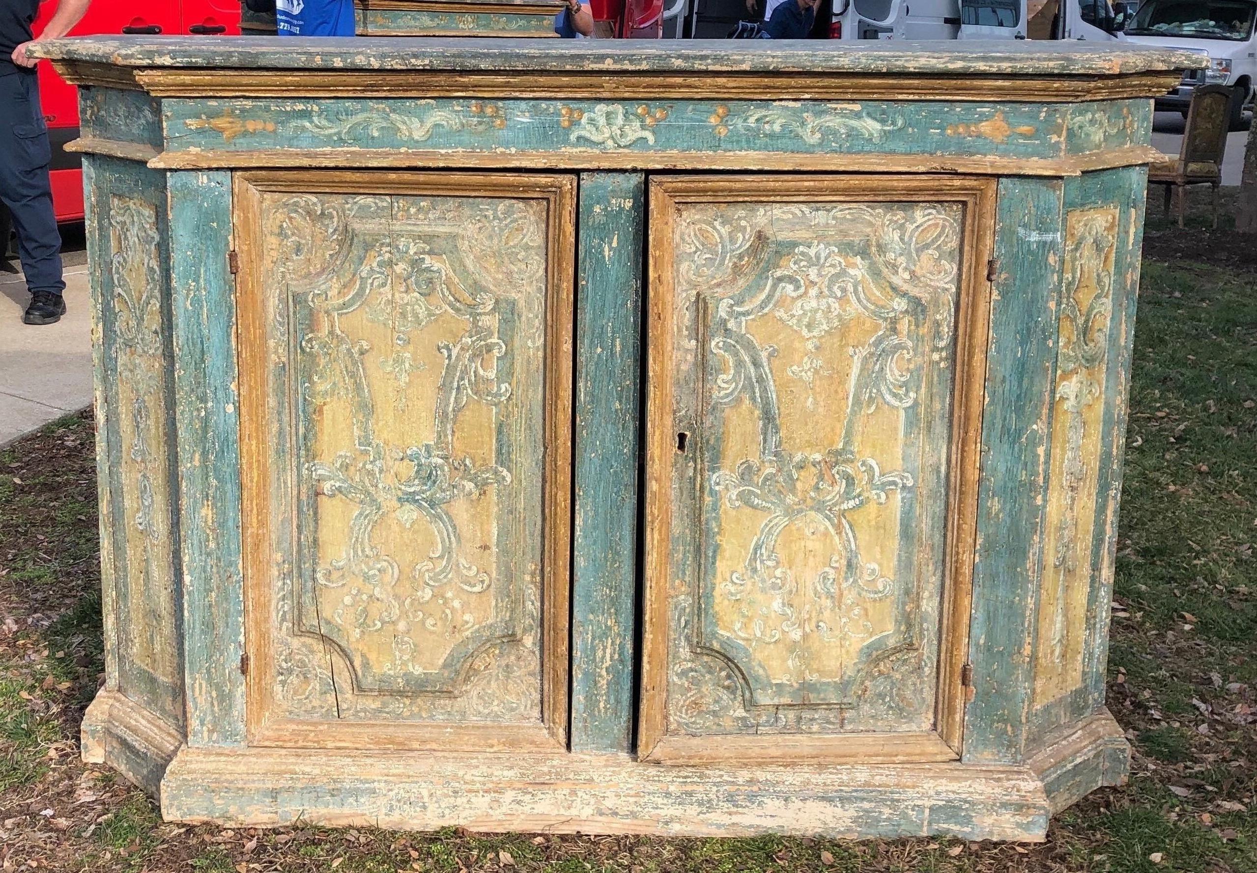 Incredible pair of 18th century Italian credenzas in original paint. Measuring 51