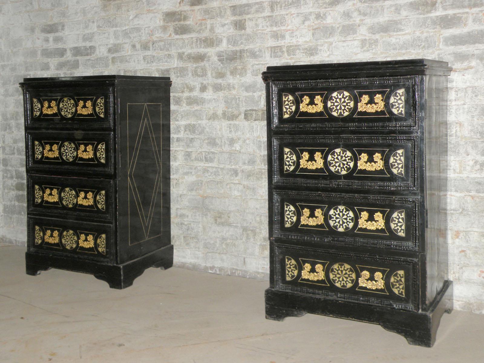 Very unique pair of early 18th Century Italian Ebonized and Inlaid Comodini or Nightstands
The rectangular tops, featuring geometric inlay, above inlaid fronts simulating four drawers with gilded brass pulls (gilding not original and can be toned