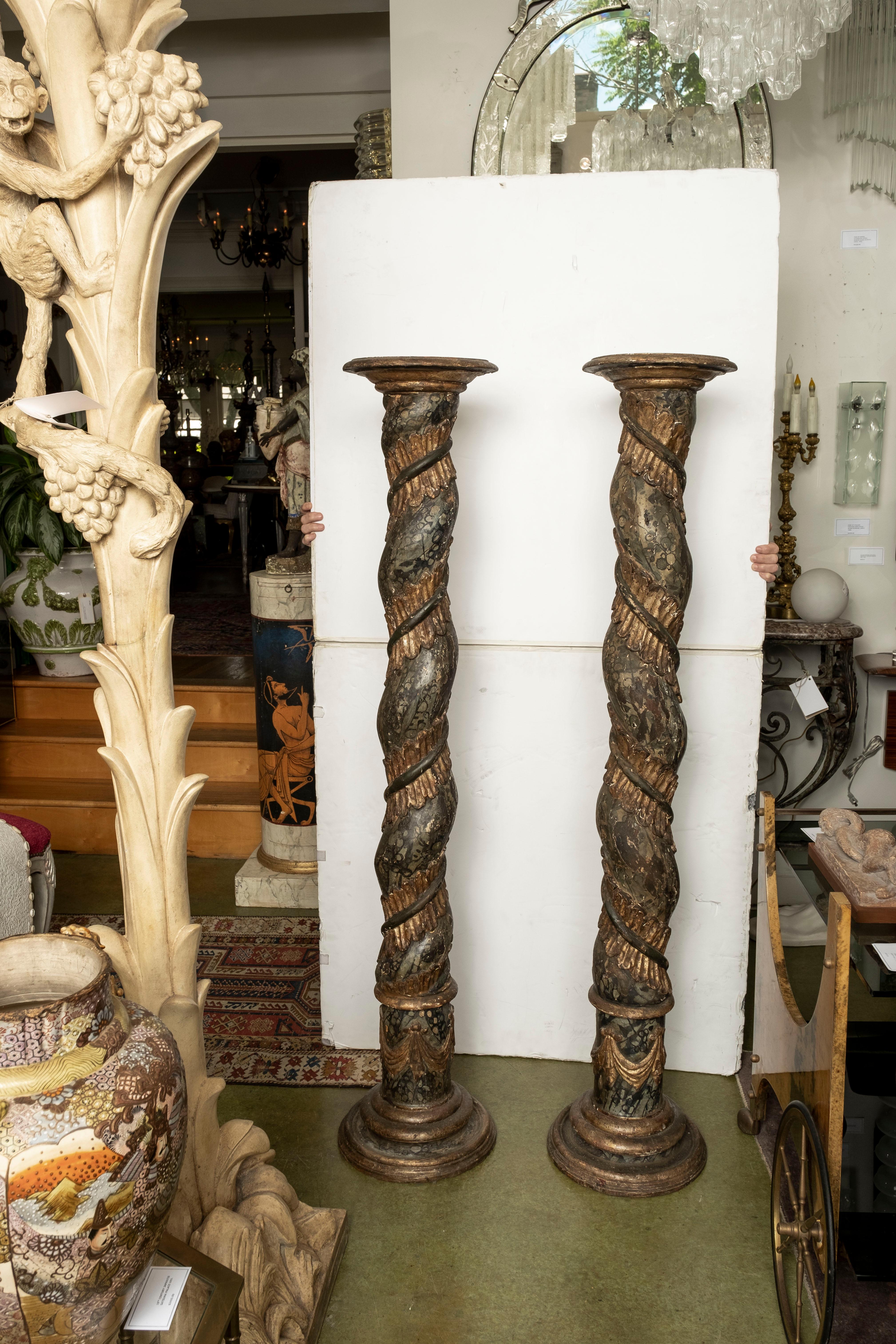 Pair of 18th century Italian Faux marble Torchères. This stunning pair of Italian Tuscan region Baroque carved wood torchieres, columns or pedestals have a faux marble and giltwood finish and would make great pair of floor lamps.