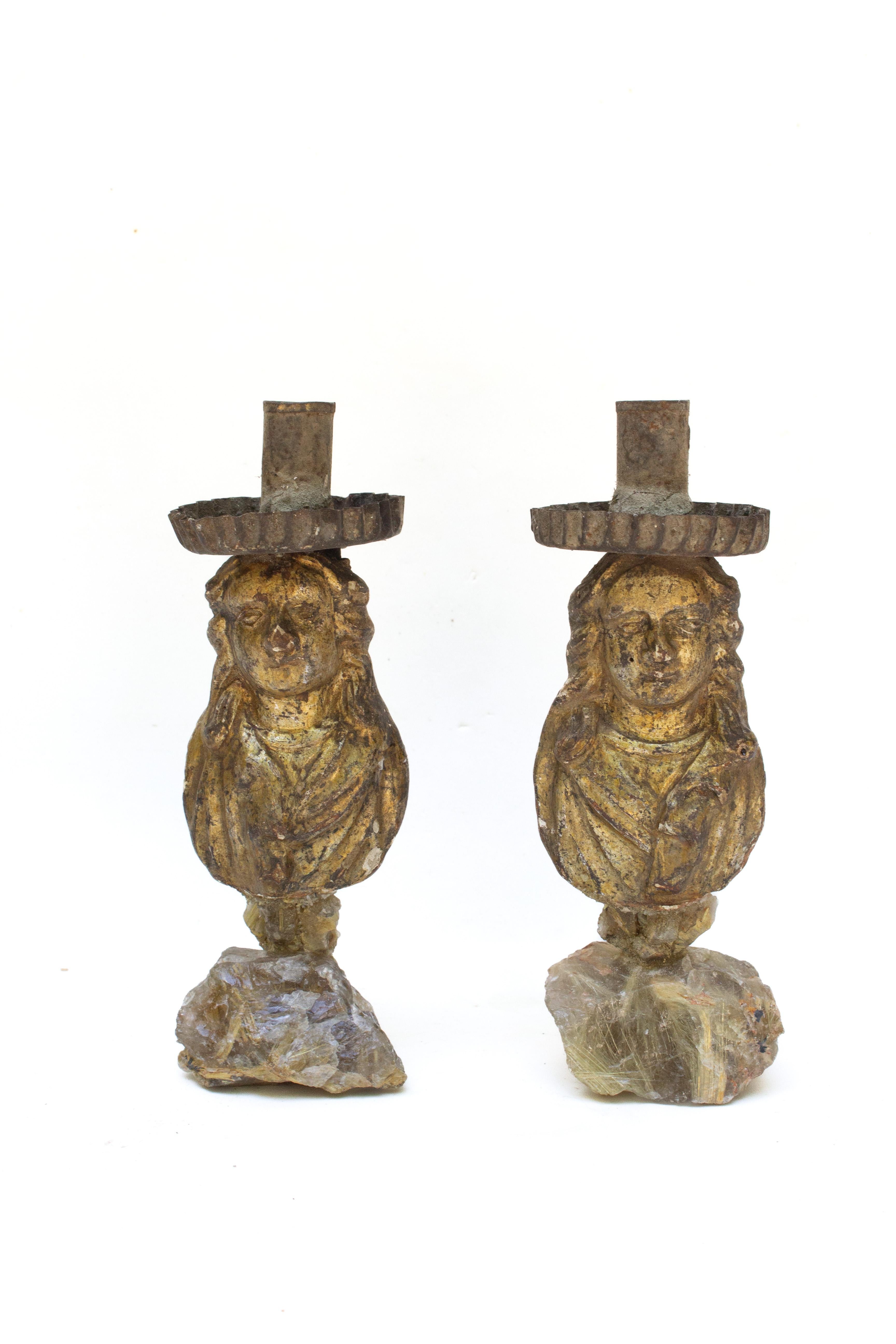 Pair of 18th century Italian mecca carved figurative candleholders on rutile in a crystal quartz matrix. The pair originally come from a historic church in Italy. They are thought to have been part of a group of other figurative candleholders that