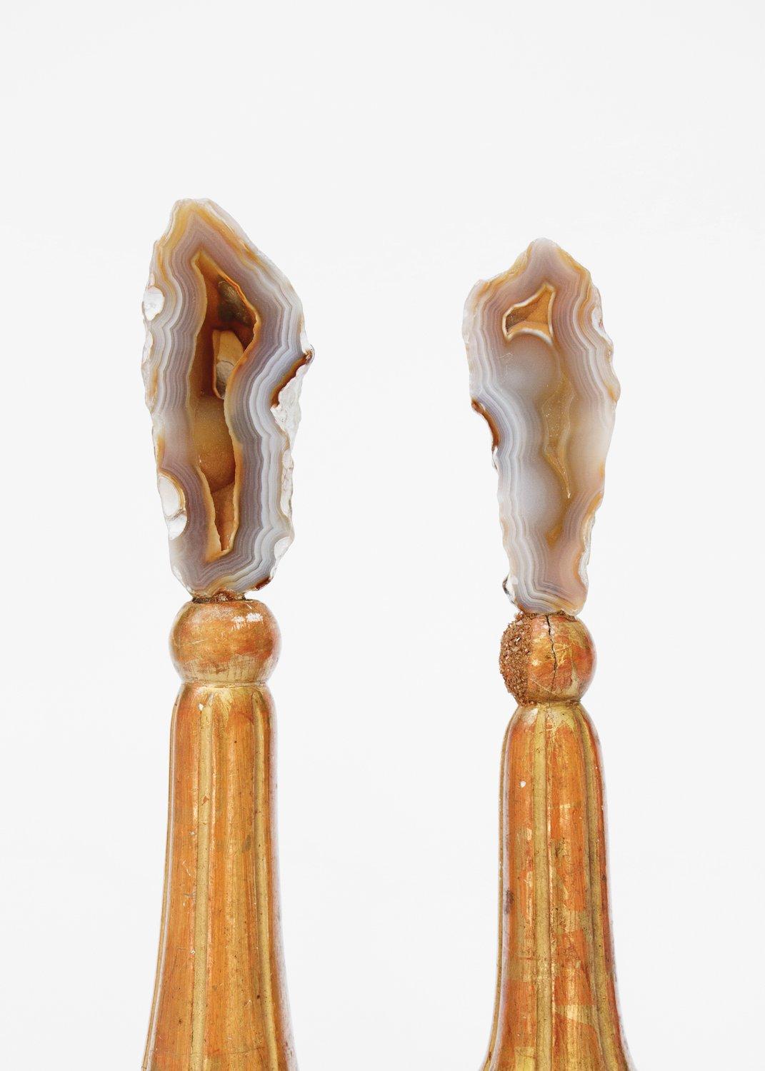 A pair of 18th century Italian finial bases with coordinating polished agate coral on a Lucite base. Florida’s state stone, agatized coral, began as living coral reef 40 million years ago in the shallow seas over Florida. 

Fossil agate coral is