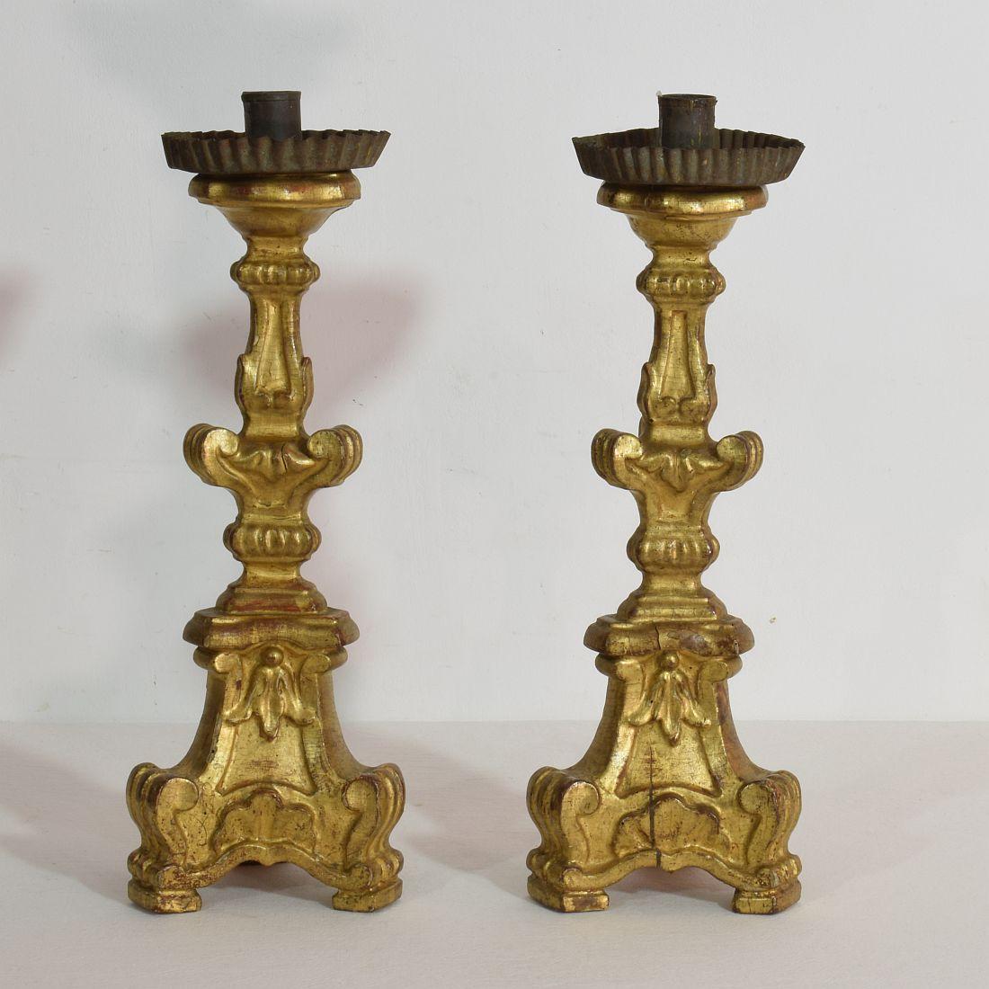 Spectacular pair of carved wooden Baroque candlesticks with beautiful gilding
Italy, circa 1760-1780.
Weathered and small losses.
  