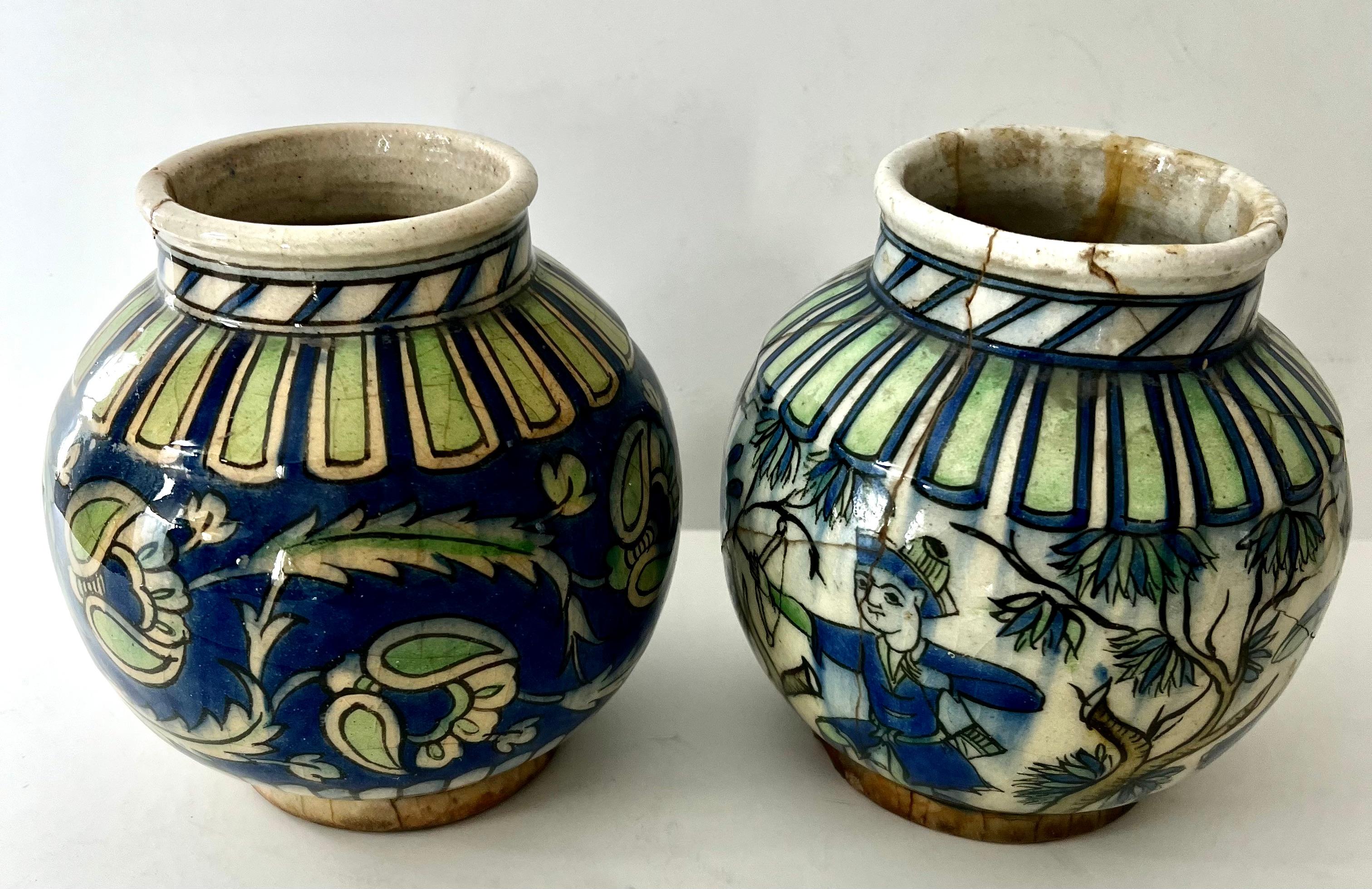 A stunning pair of Italian Containers / planters. The pair are wonderful decorative pieces. Both have different hand painted decor or scenes that are very decorative and lovely - both have colors that compliment each other.

A compliment to any