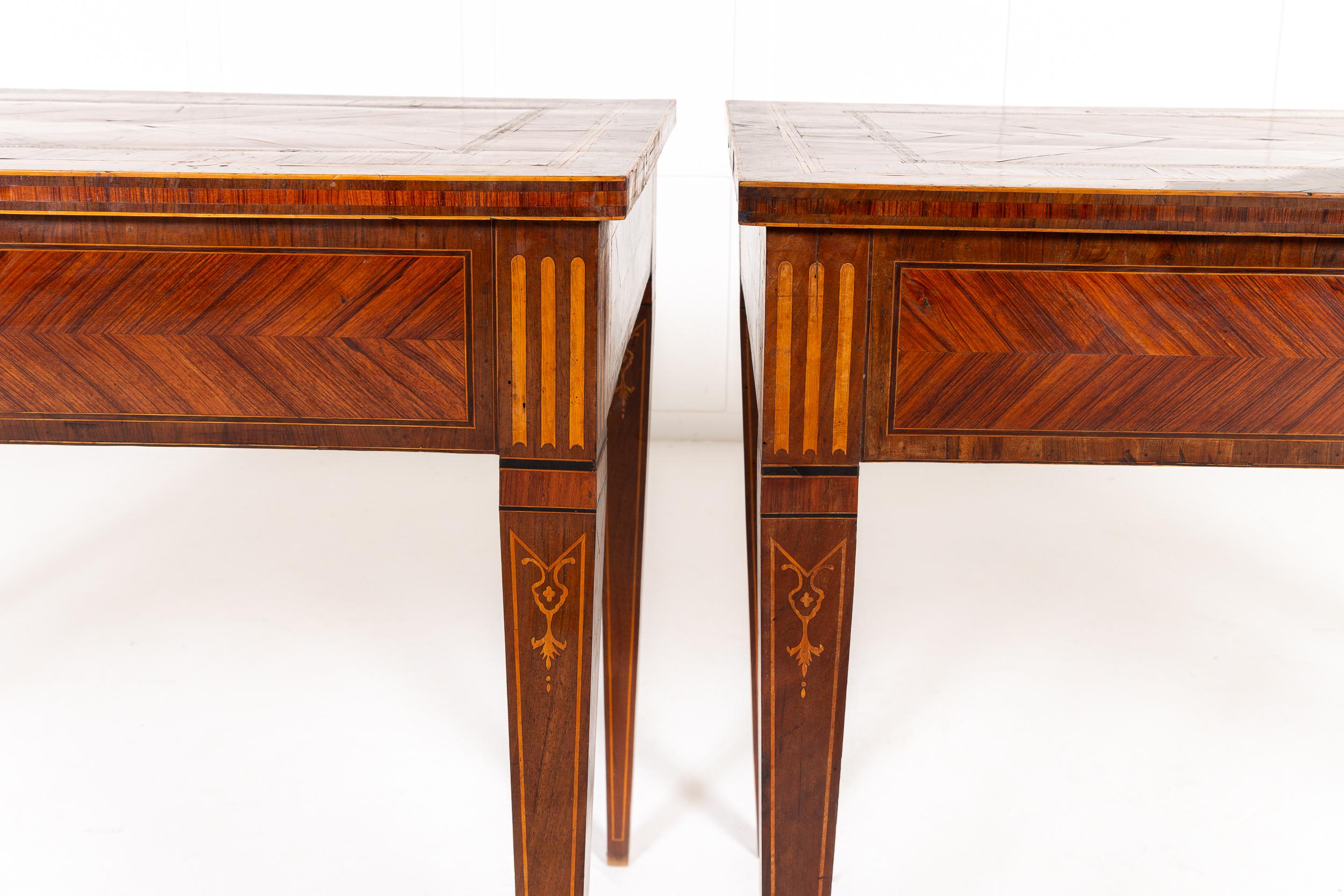 An Elegant Pair of 18th Century Italian Kingwood and Walnut Veneered Console Tables.

This elegant pair of Italian console tables from the 18th century have distinctive and exquisite kingwood veneers and delicate inlay throughout. The tops are