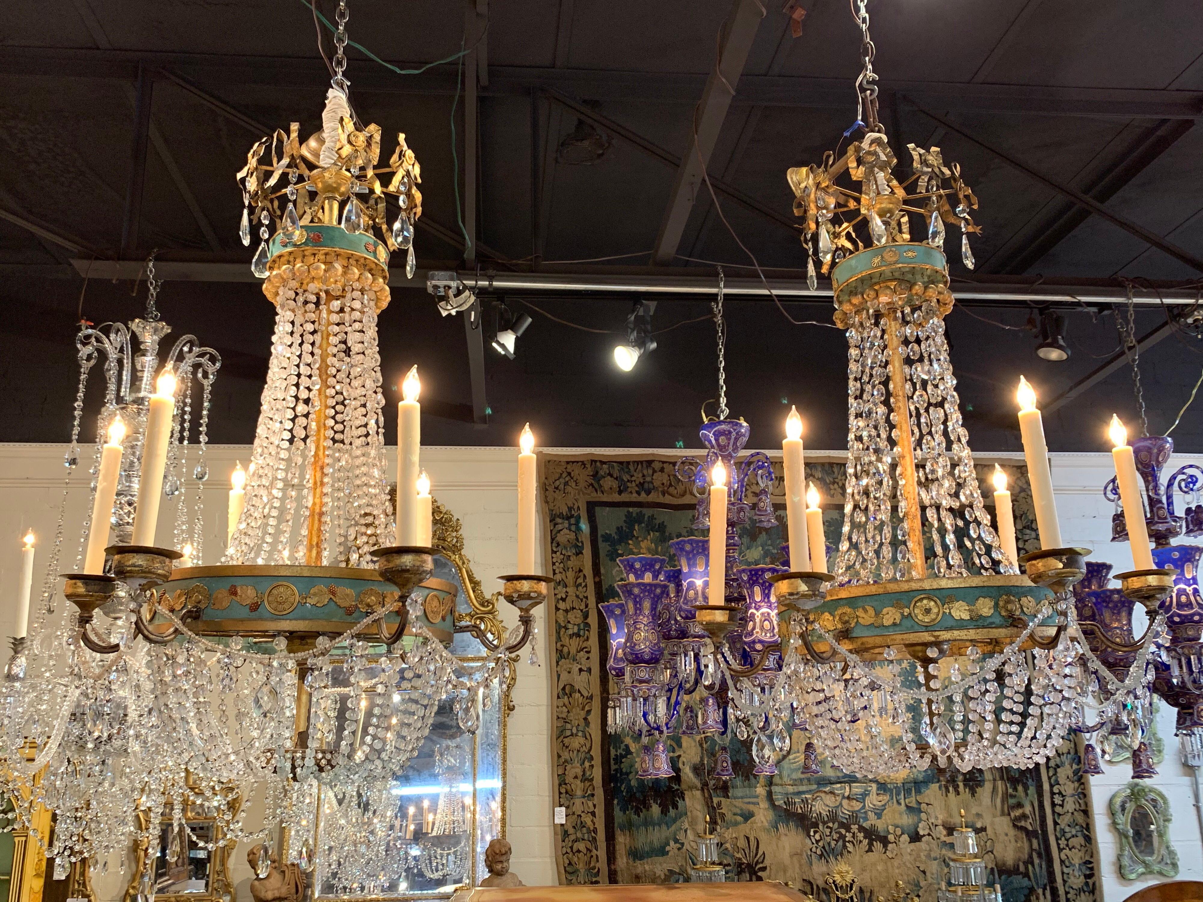 Exquisite pair of 18th century Italian neoclassical crystal and painted tole basket chandeliers with 6 lights. Crystals on these are outstanding. Beautiful tole patterns with leaves, grapes and flowers. An exceptional pair!