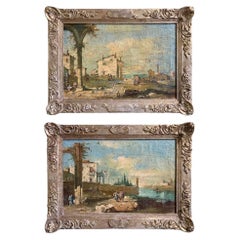 Pair of 18th Century Italian Oil Landscape Scenes in Carved Silvered Frames