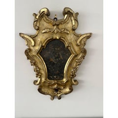 Coppia di specchi italiani in legno dorato in stile rococò del XVIII secolo
