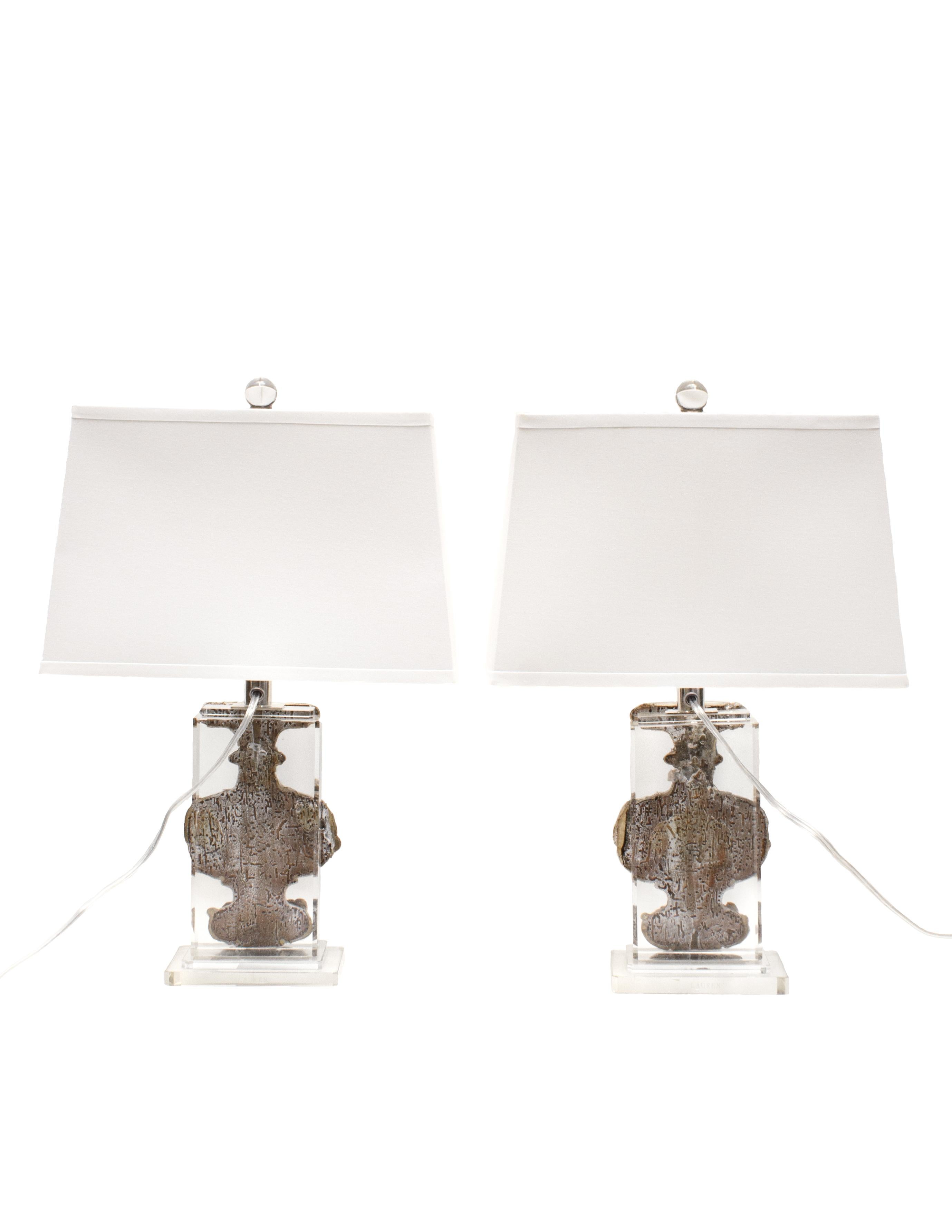 Pair of 18th century Italian silver leaf fragment vases applied to Lucite lamp bases. 

The 18th century artifacts vases originally came from a church in Liguria, Italy. They are silver-leafed with hand carved details of angels. The artifacts have