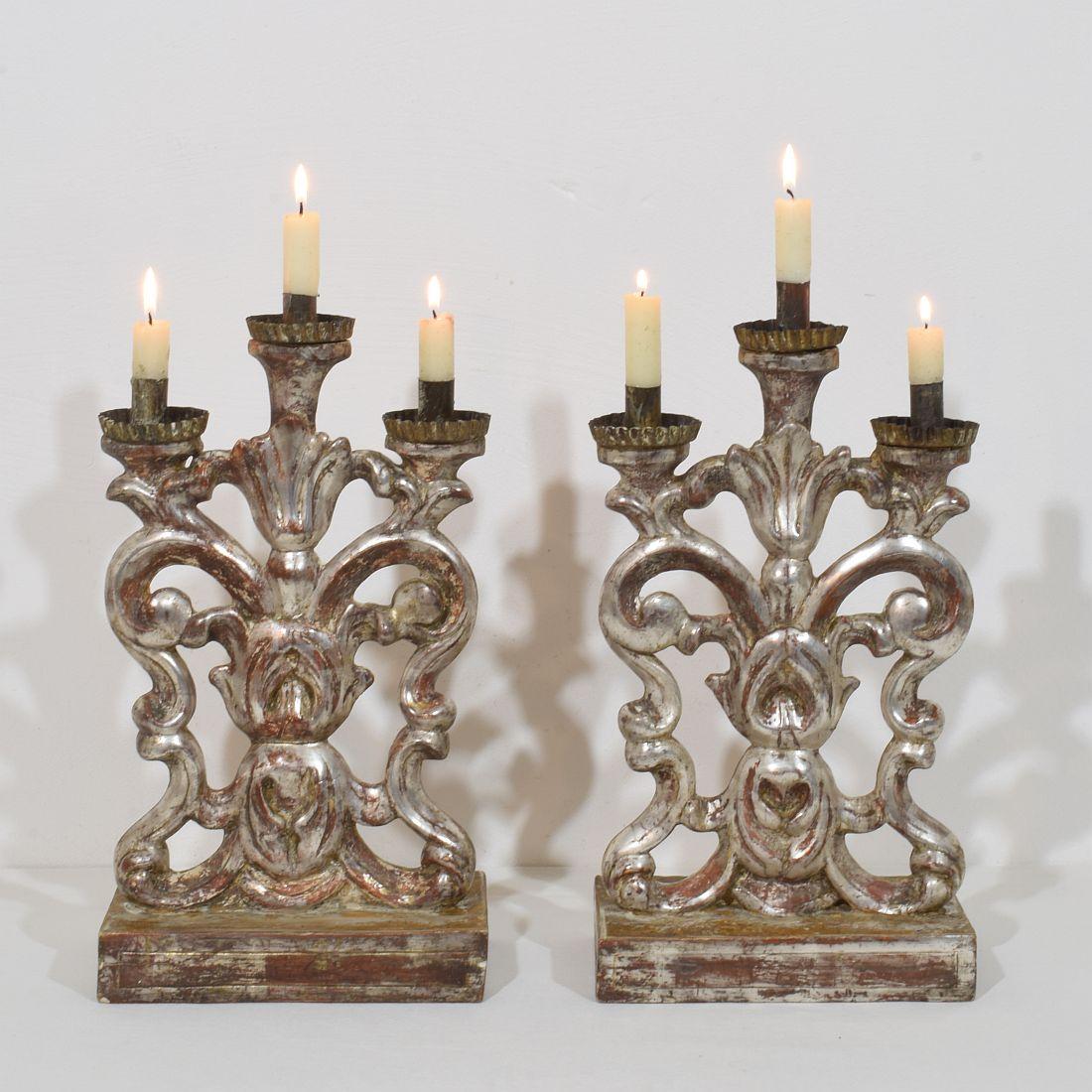 Unique Baroque silvered candleholders for in total 6 candles, Italy, circa 1750-1780. Weathered, repairs and losses.
More pictures available on request. Measurement individual.
H:40,5cm  W:22cm D:11,5cm 