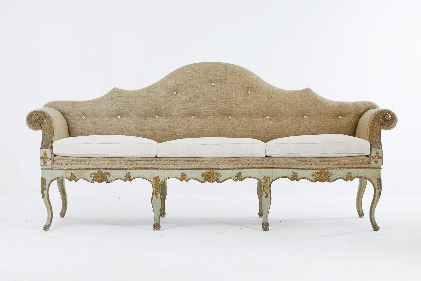 This rare and elegant pair of 18th century Venetian sofas has out swept arms with carved wood scrolls in each side and a raised back.
Retaining their beautiful, original paint and giltwood detail throughout the whole body of the frame.
The sofas