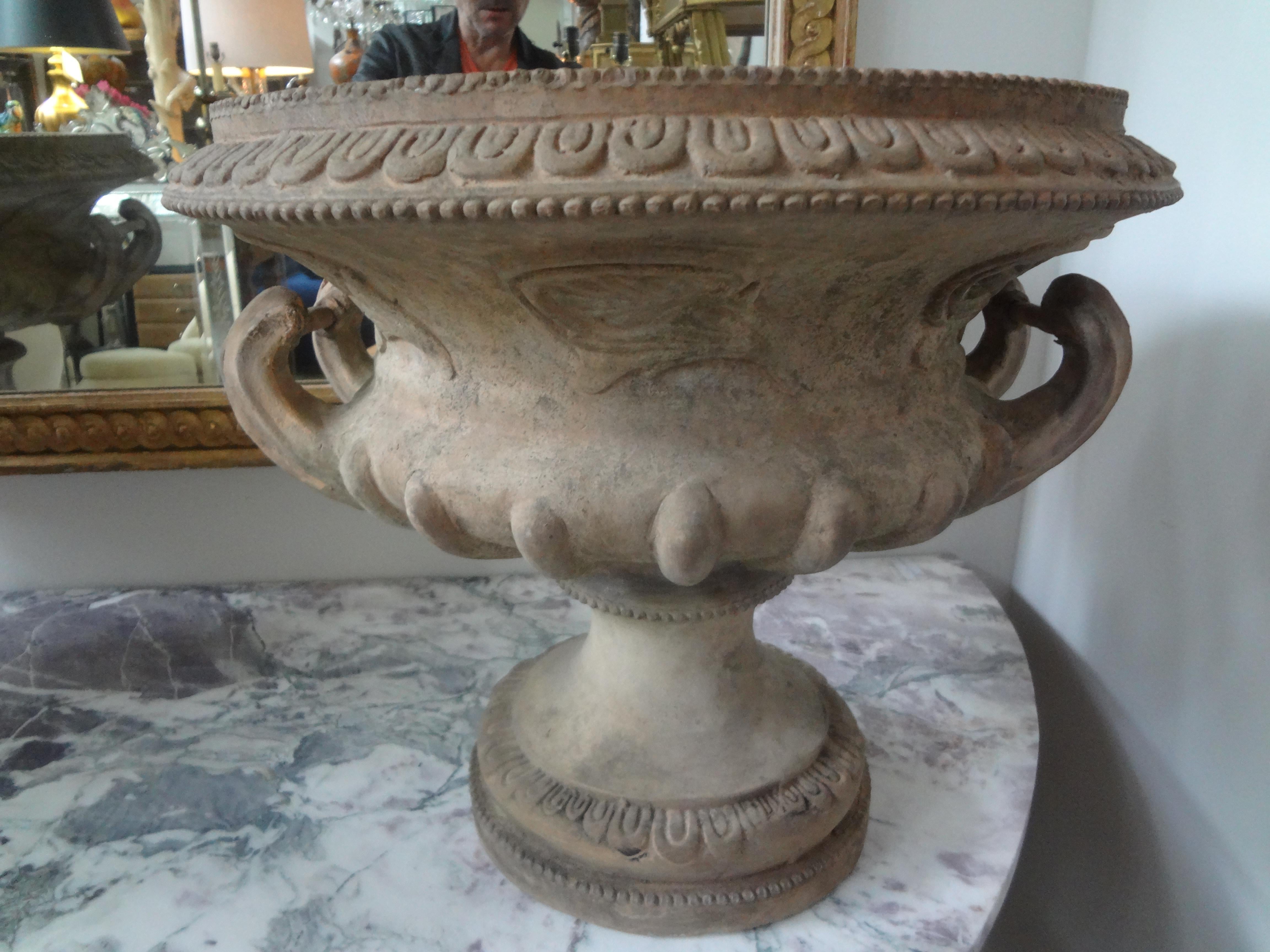Pair of 18th century Italian terracotta urns.
This stunning pair of antique Italian Grecian style terra cotta urns, garden urns, planters or jardinieres have beautiful detailing with side handles. Previous minor restoration.