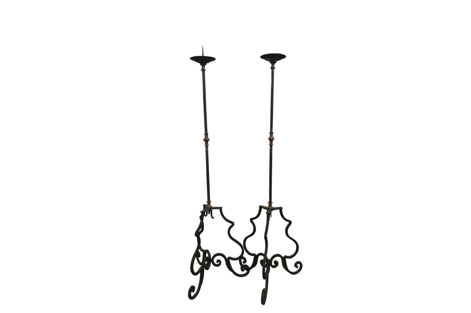 A very striking pair of 18th century Italian torcheres crafted from hand forged iron and bronze. Beautiful.