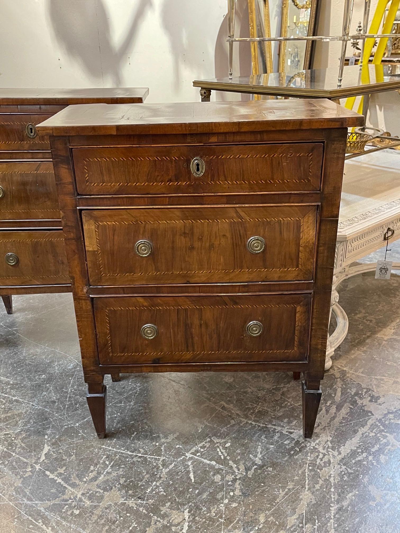 Elegant pair of 18th century Italian walnut commodes. Pretty inlaid pattern on the tops and on the drawers. Creates a very polished look!
