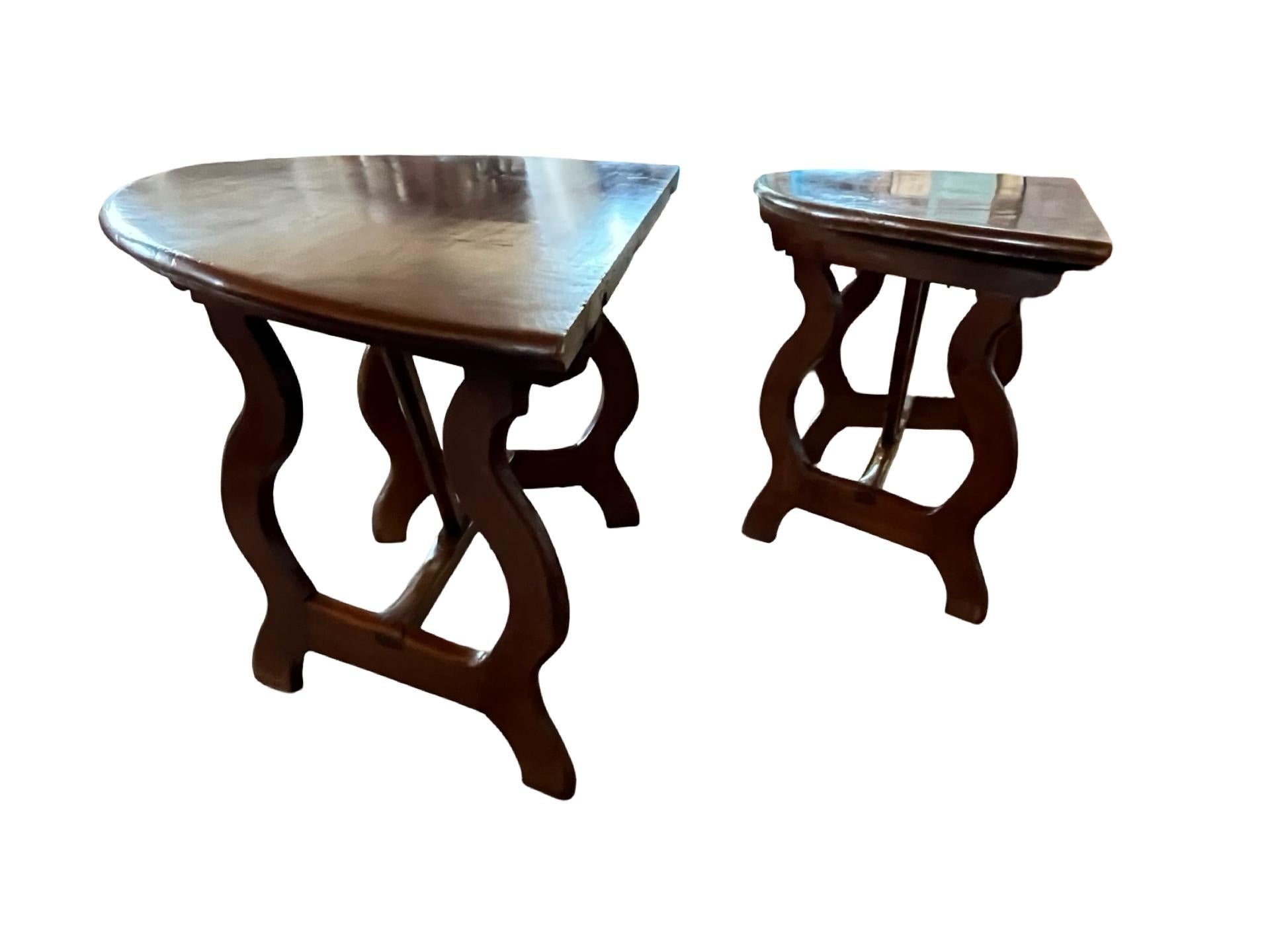 Demi-lune consoles hand-made in Italy in the late 1700s using pegged construction. The pair of tables has gorgeous lines and beautiful color, and can be used as console tables against a wall, but also together to make a slightly oval center table