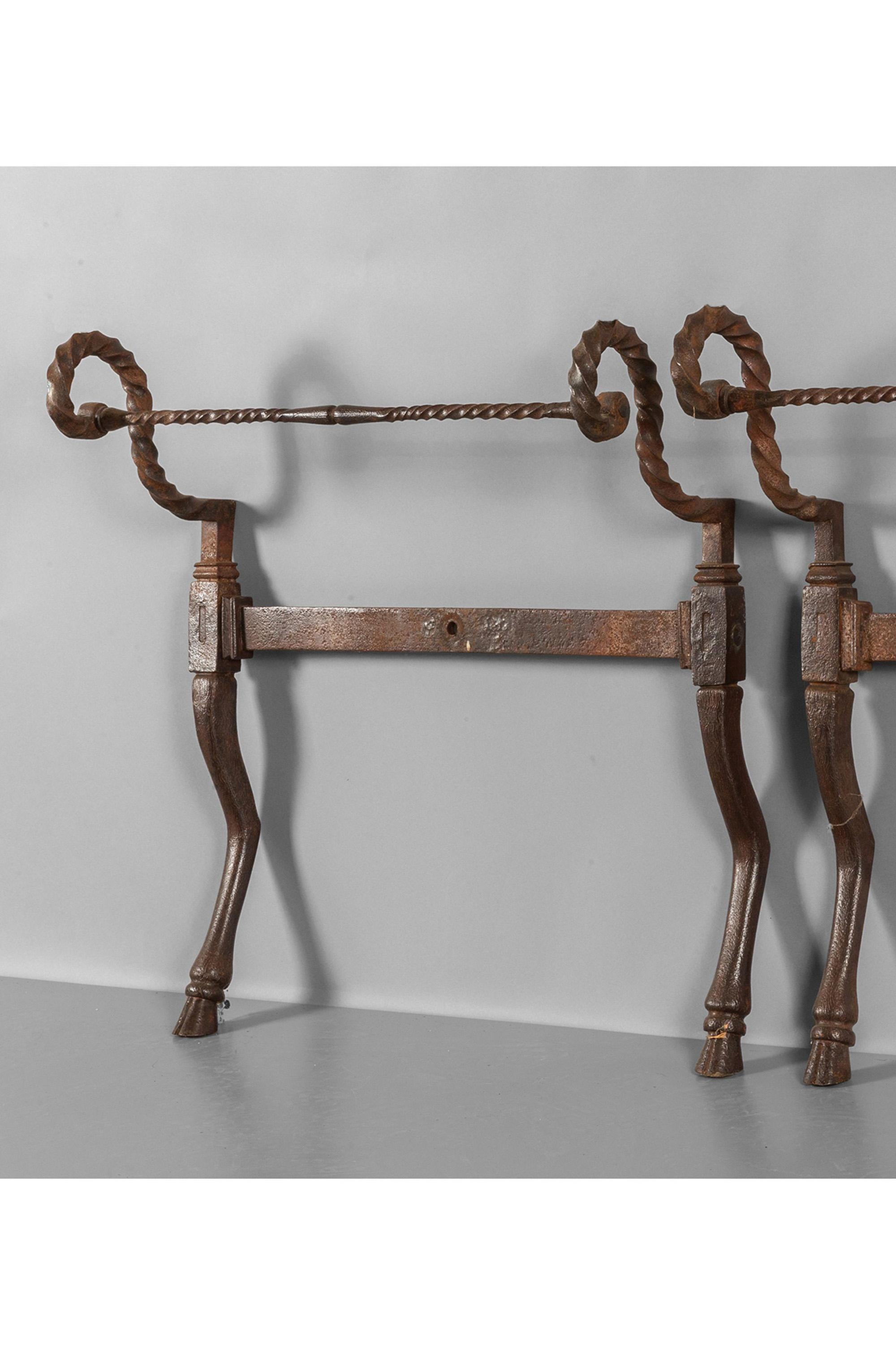 A pair of sculptural wrought iron daybed ends with scrolling arms, terminating in hand beaten hoof decoration. Ligura, 18th Century.

The antique metalwork has developed a wonderful patina. Supplied as seen, or as an upholstered daybed, to be made