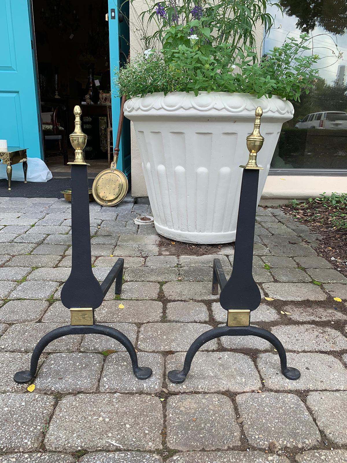 Pair of 18th century knife blade style andirons with brass details.