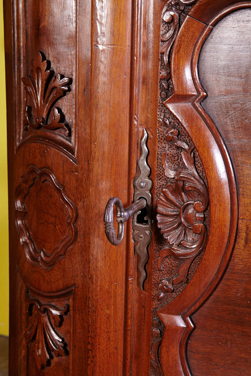 French Pair of 18th Century Louis XV Carved Walnut Corner Cabinets from Lyon For Sale