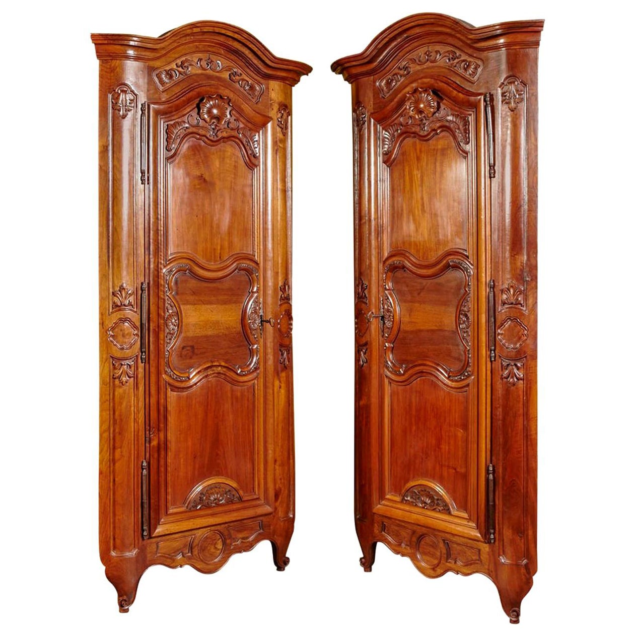 Pair of 18th Century Louis XV Carved Walnut Corner Cabinets from Lyon