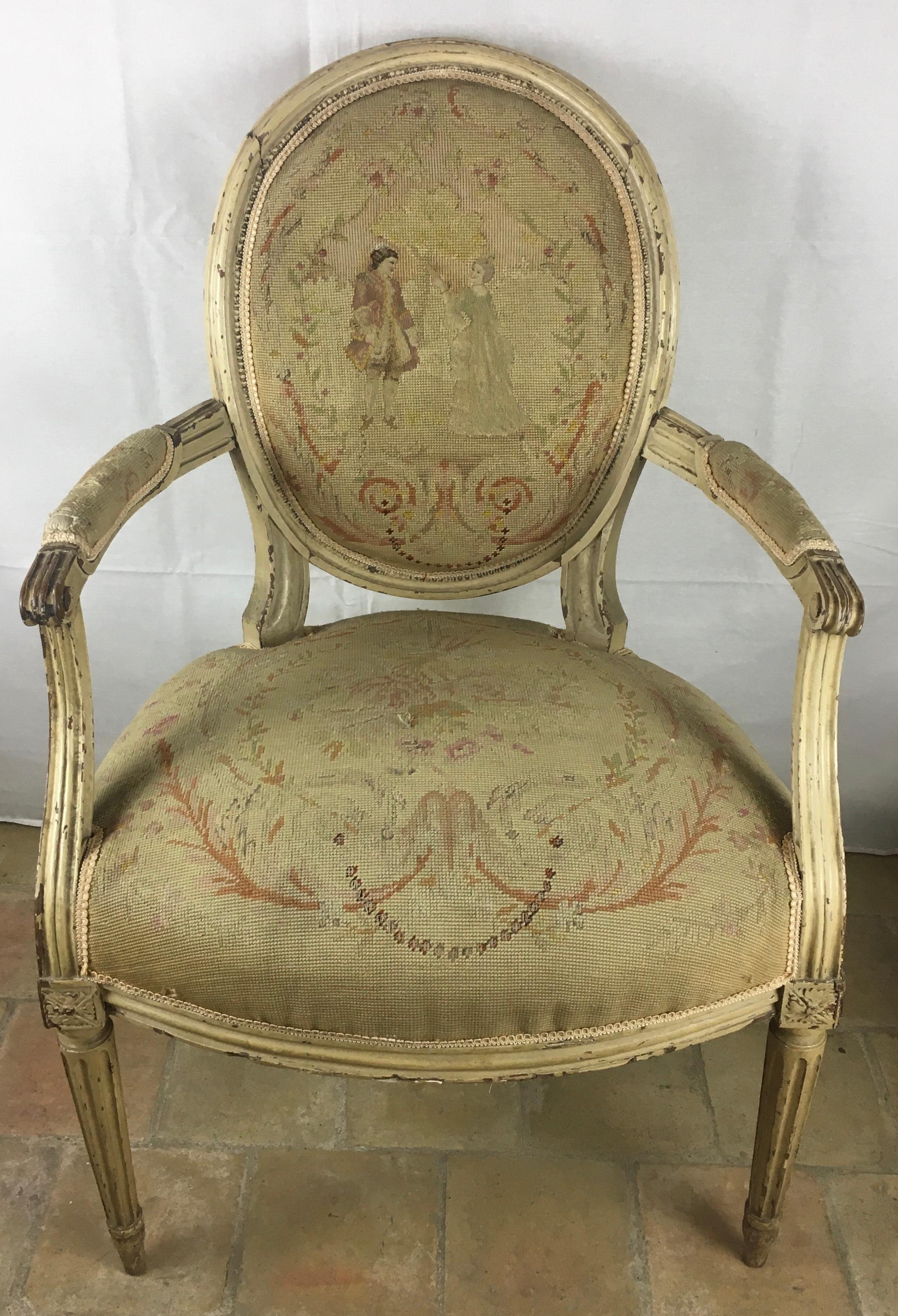 Very fine pair of 18th century French Louis XVI armchairs, scrolled arms, over bow fronted seat, standing on  fluted legs. Retaining mostly original paint and with period needlework upholstery. Presumably Aubusson fabric.  Chairs need to be