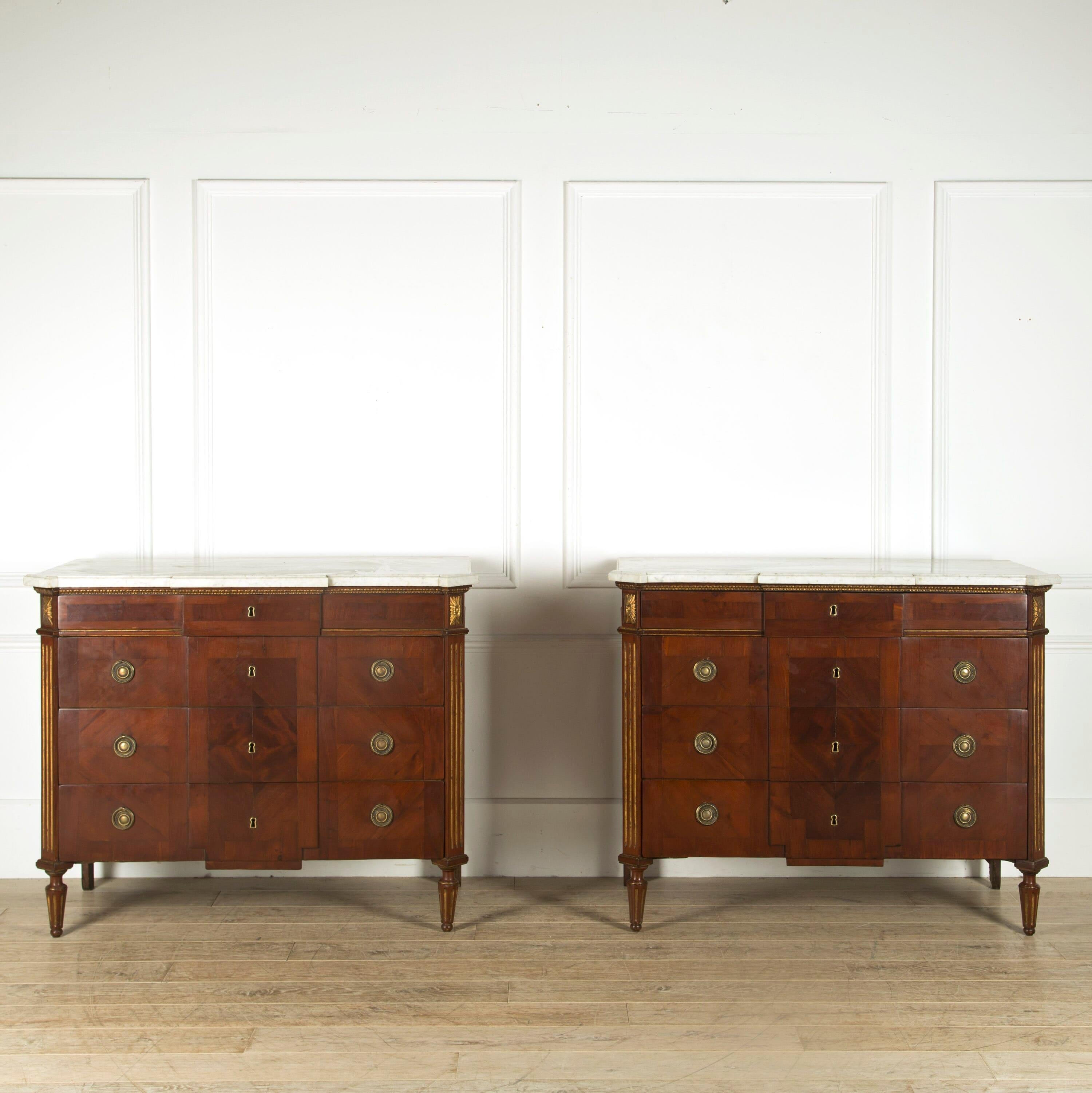 Pair of late 18th century Spanish mahogany commodes with marble tops and gilded decoration.