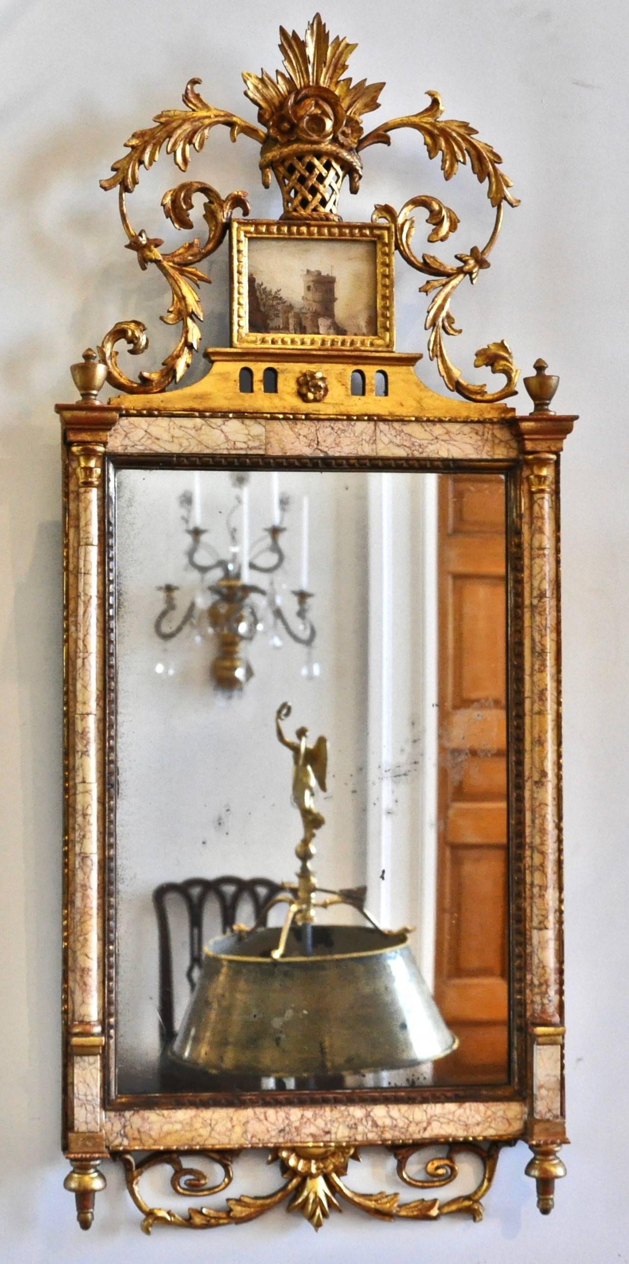Pair of 18th century Spanish gilt and marble Bilbao mirrors with original Églomisé panels in crest

-Carved and gilt
-Sienna marble
-Églomisé of Harbor scene and one of a castle rampart.
 