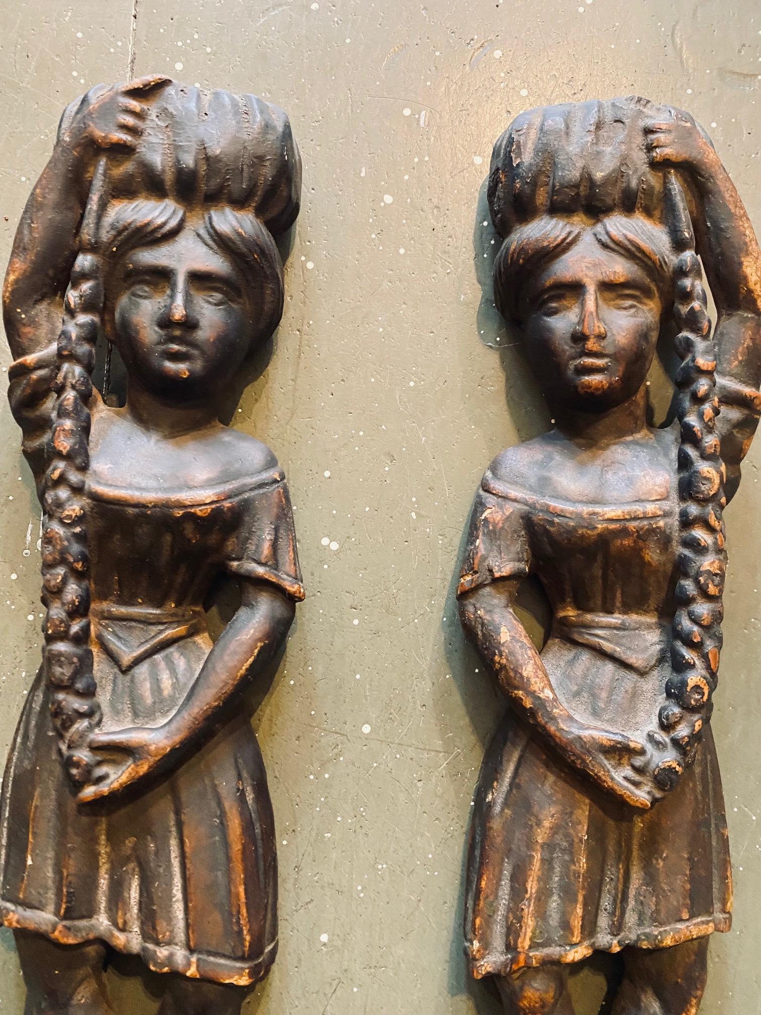 Extremely rare and very special pair of 18th century native American tobacco store hanging trade figures, hand carved in the half round full length figures of two American Indian women portrayed in the classical noble fashion prominent in the 17th