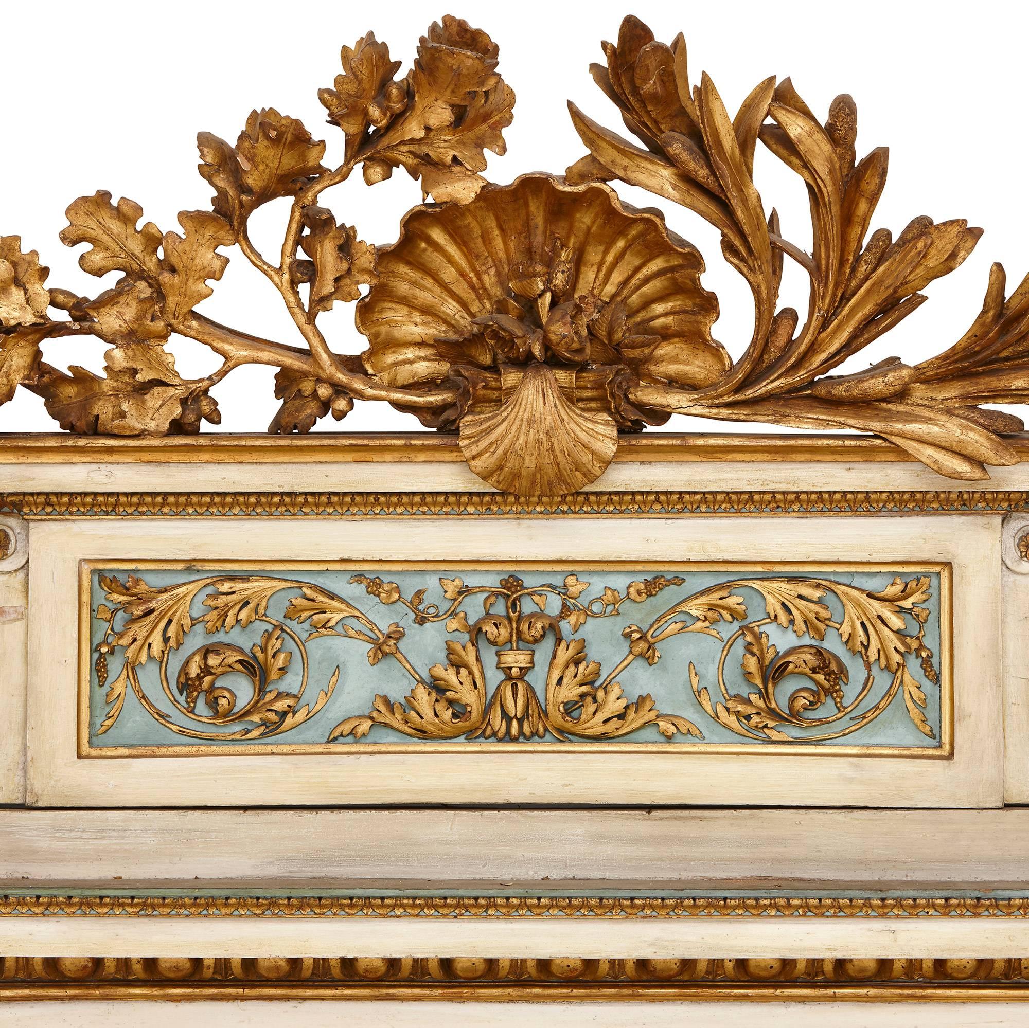 The pair of 18th century mirrored console tables are crafted in painted and gilded wood in a harmonious pastel color scheme of cream, blue and gold. 

The consoles are of rectangular form and are each set on four square, fluted, tapered legs,