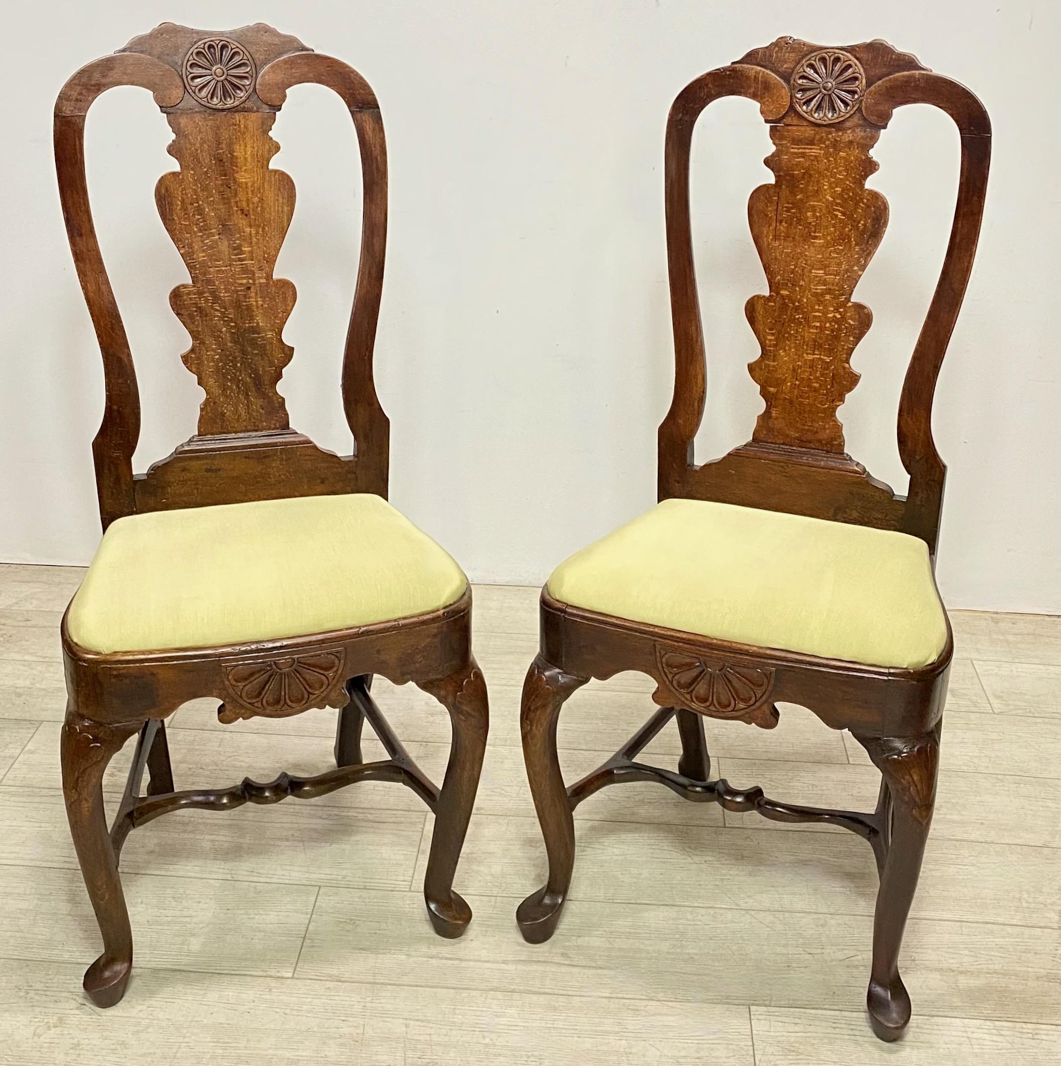 A pair of mid 18th century English or Dutch oak side chairs.
Recently refinished and upholstered.
Some professional old repairs but chairs are very sturdy and sound.