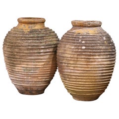 Pair of 18th Century Patinated Greek Terracotta Olive Jars with Ochre Glaze