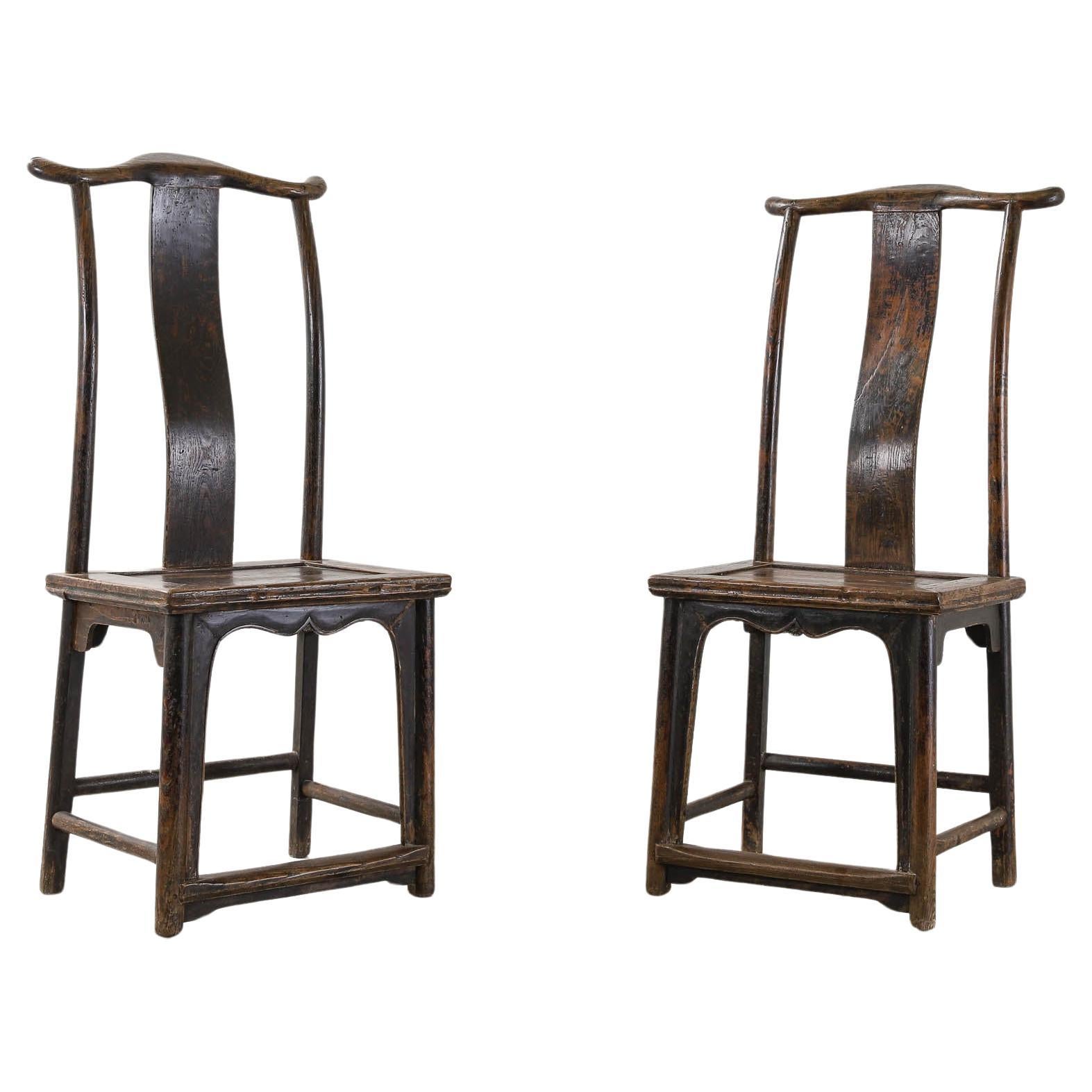 Pair of 18th Century Qing Dynasty Yoke-back Chinese Elm chairs For Sale