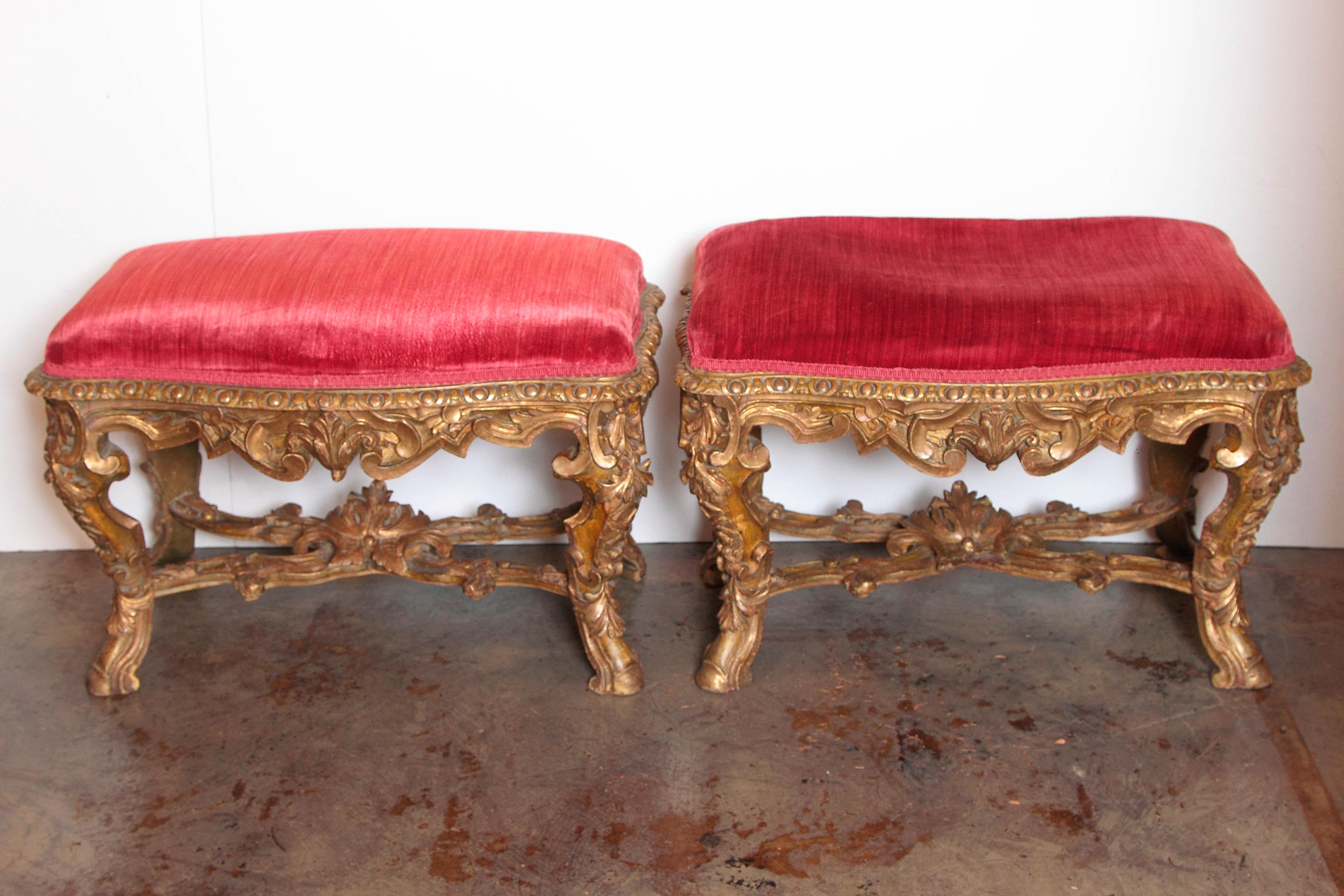 Pair of 18th century French Regence period carved and gilt benches.