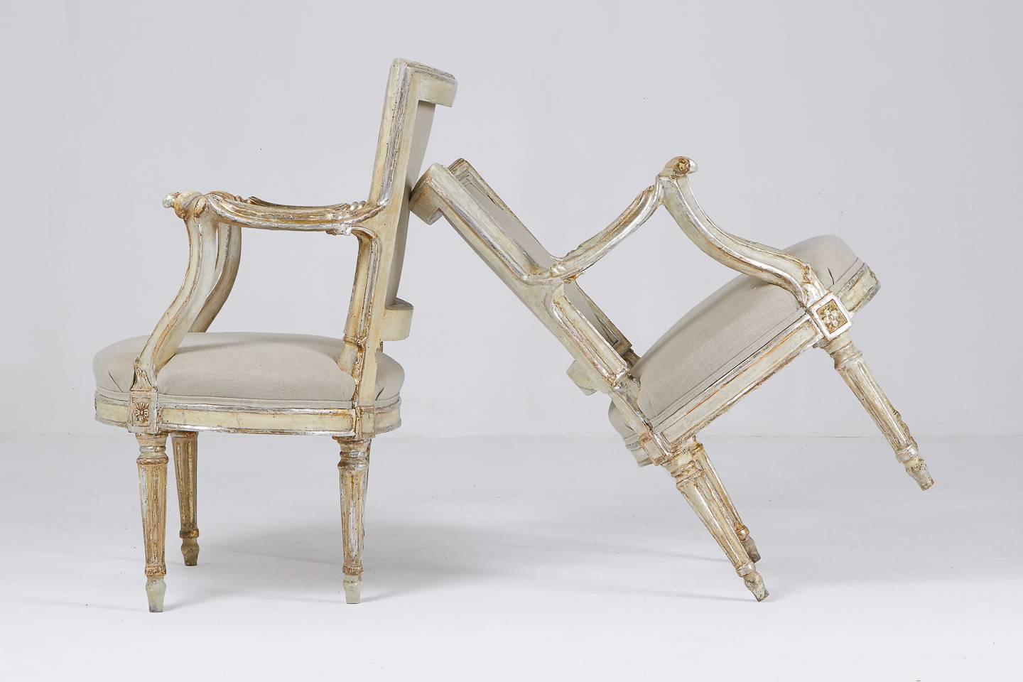 Unusual design, petite pair of 18th century silver gilt and painted Italian armchairs.

Measure: Seat height 40cm.