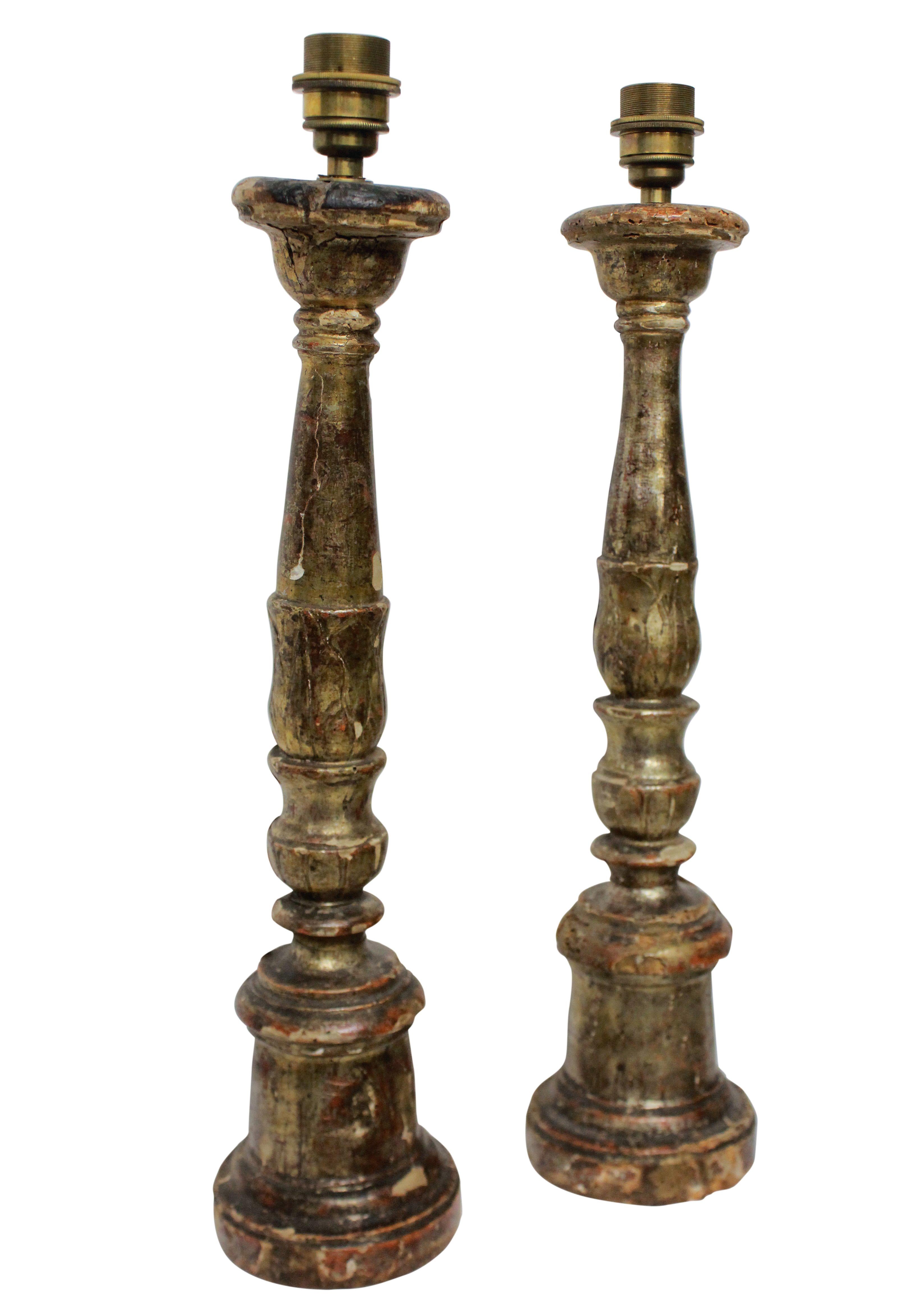 A pair of Italian 18th century silver leaf candlesticks as lamps.