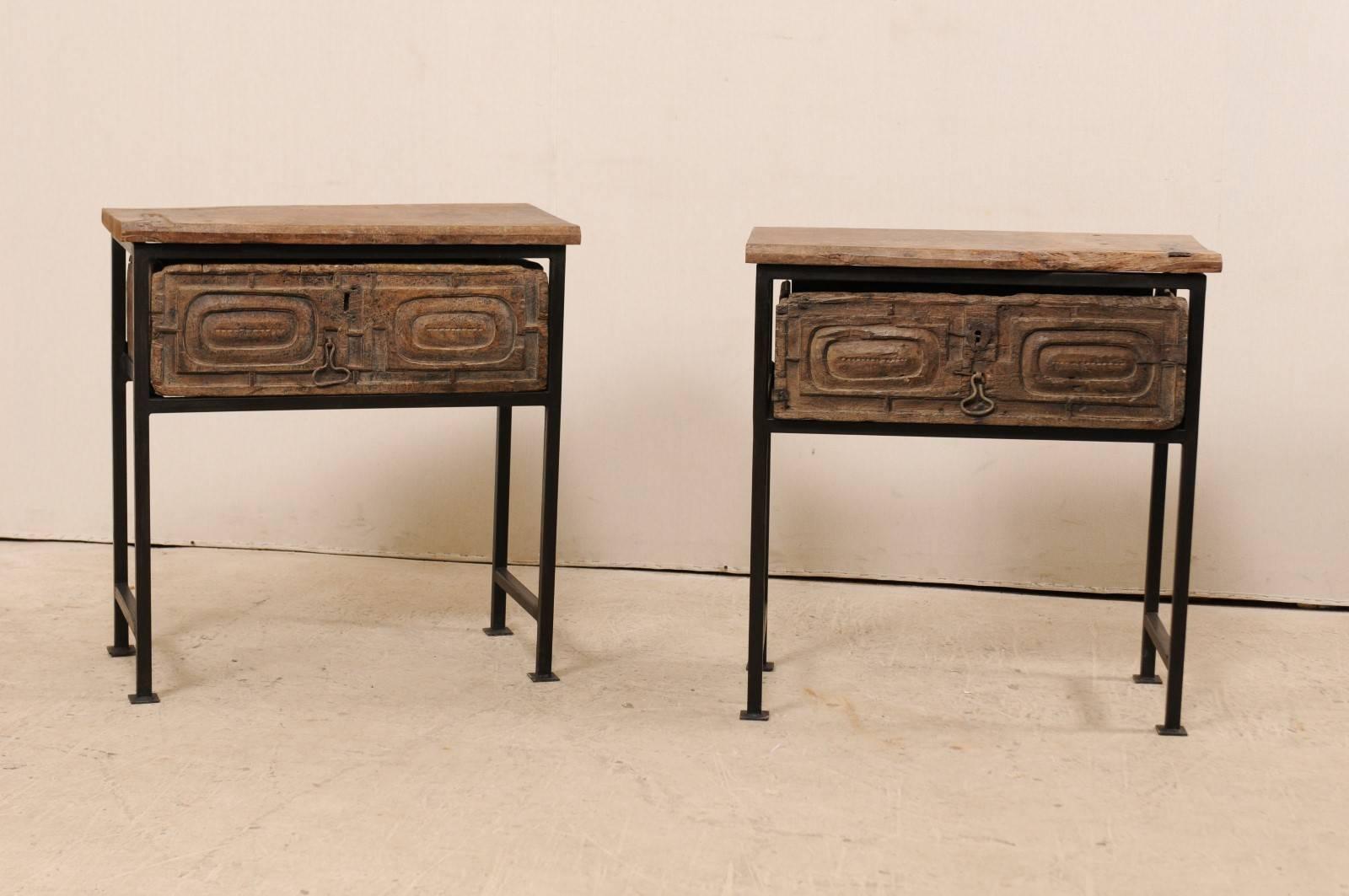 A pair of unique 18th century Spanish chests or tables. This pair of 18th century (or earlier) Spanish drawers have been set into a custom iron base and older wood tops to produce this fantastic pair of statement pieces. The tops and drawers are a