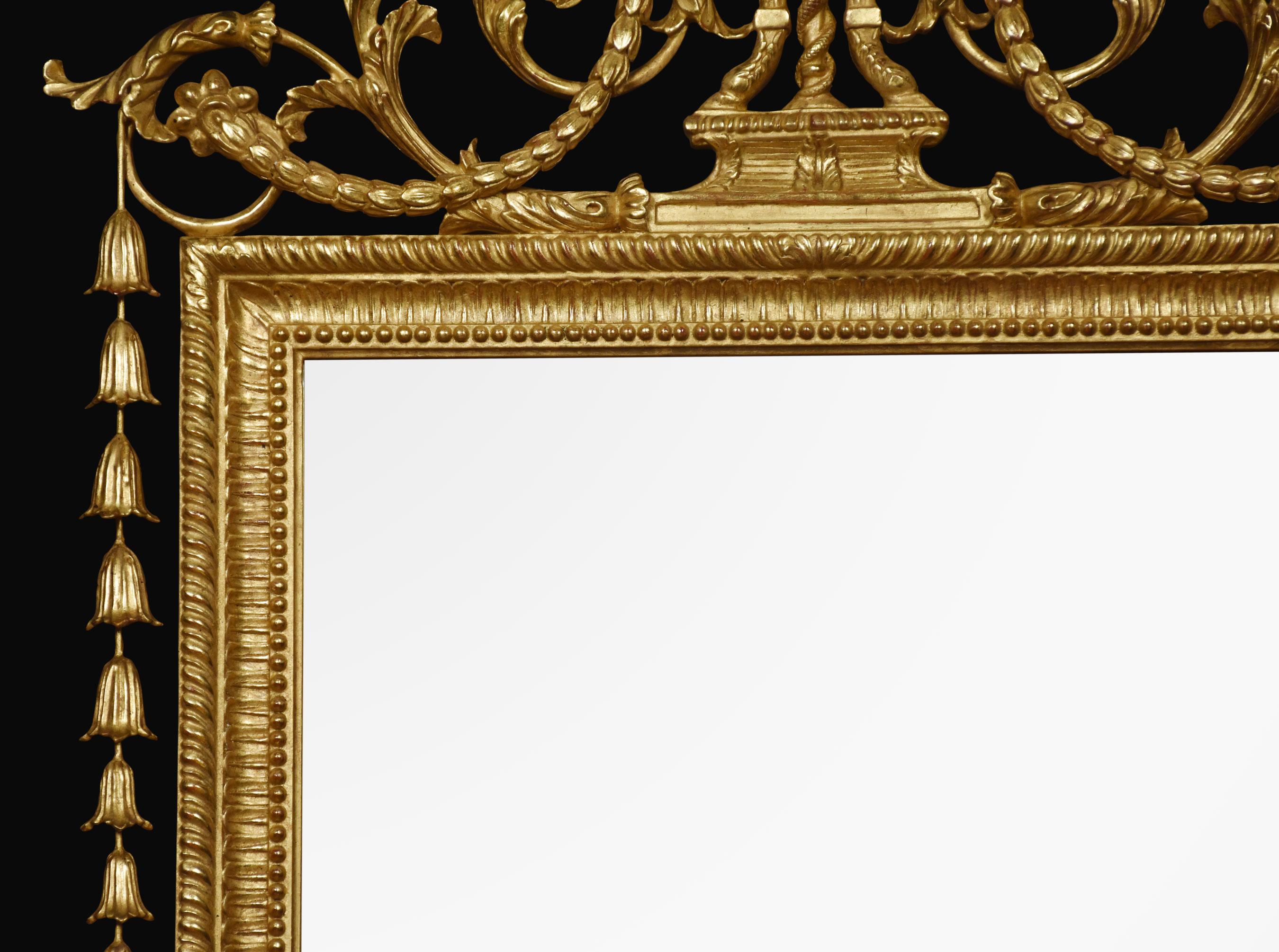 Large pair of 18th century-style giltwood wall mirrors with acanthus and flaming urn cresting, cavetto molded frames and bell flower sides, surrounding the original mirror plate.
Dimensions
Height 69 inches
Width 33.5 inches
Depth 2 inches.