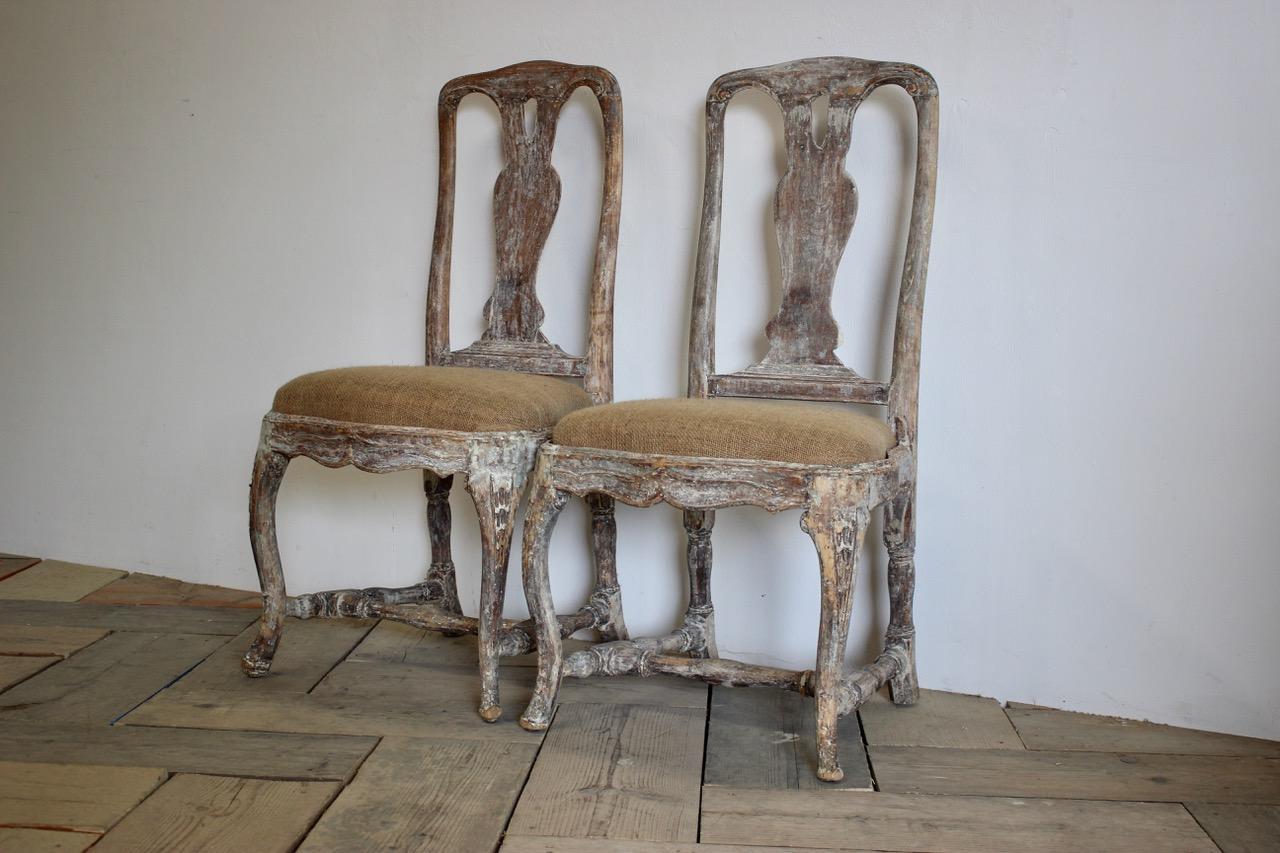 A charming pair of 18th century Swedish painted Rococo chairs retaining the original paint and with a lovely color.