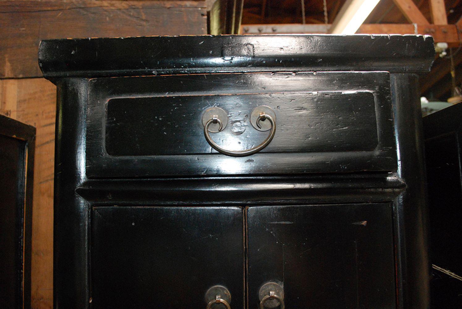 Pair of 18th century tall tea tables with one drawer and two doors finished in a black lacquer. From Shanshi.