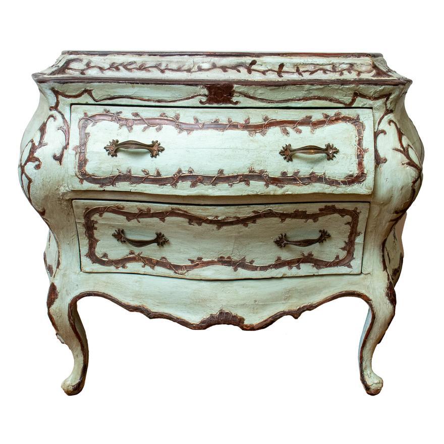 Pair of Venetian painted and gilt 18th century commodes. Bombe in Form. One is Circa 1750 the other a later copy made in exacting detail and decoration. Beautiful pair of chest of drawers.

Provenance: Park Avenue, New York Private Collection.

