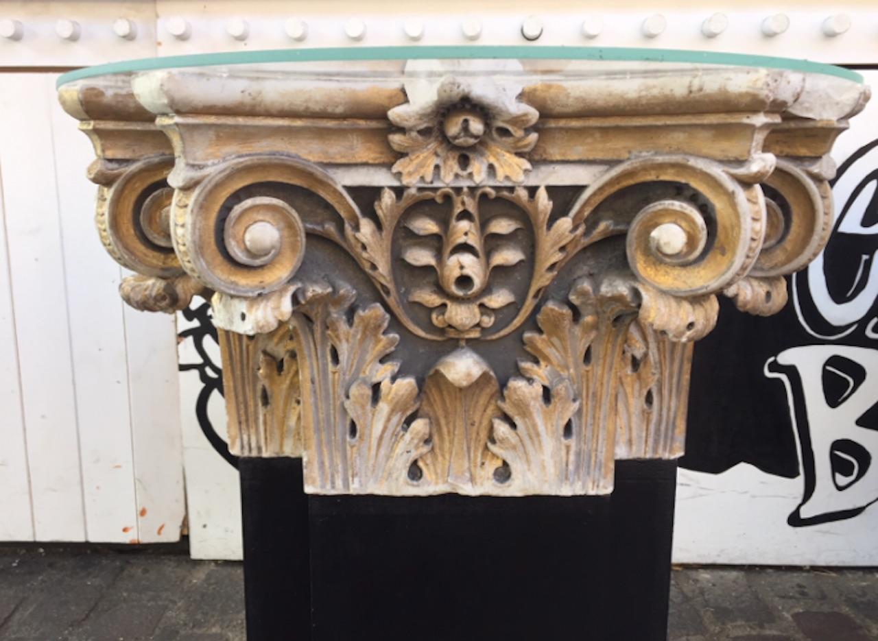 A pair of 18th century white marble and gold gilt columns tops from a Italy's church. Converted into side tables these beautiful crafted column feature excellent flawless carving of scrolls and foliage. Perfect for a interior or exterior use.