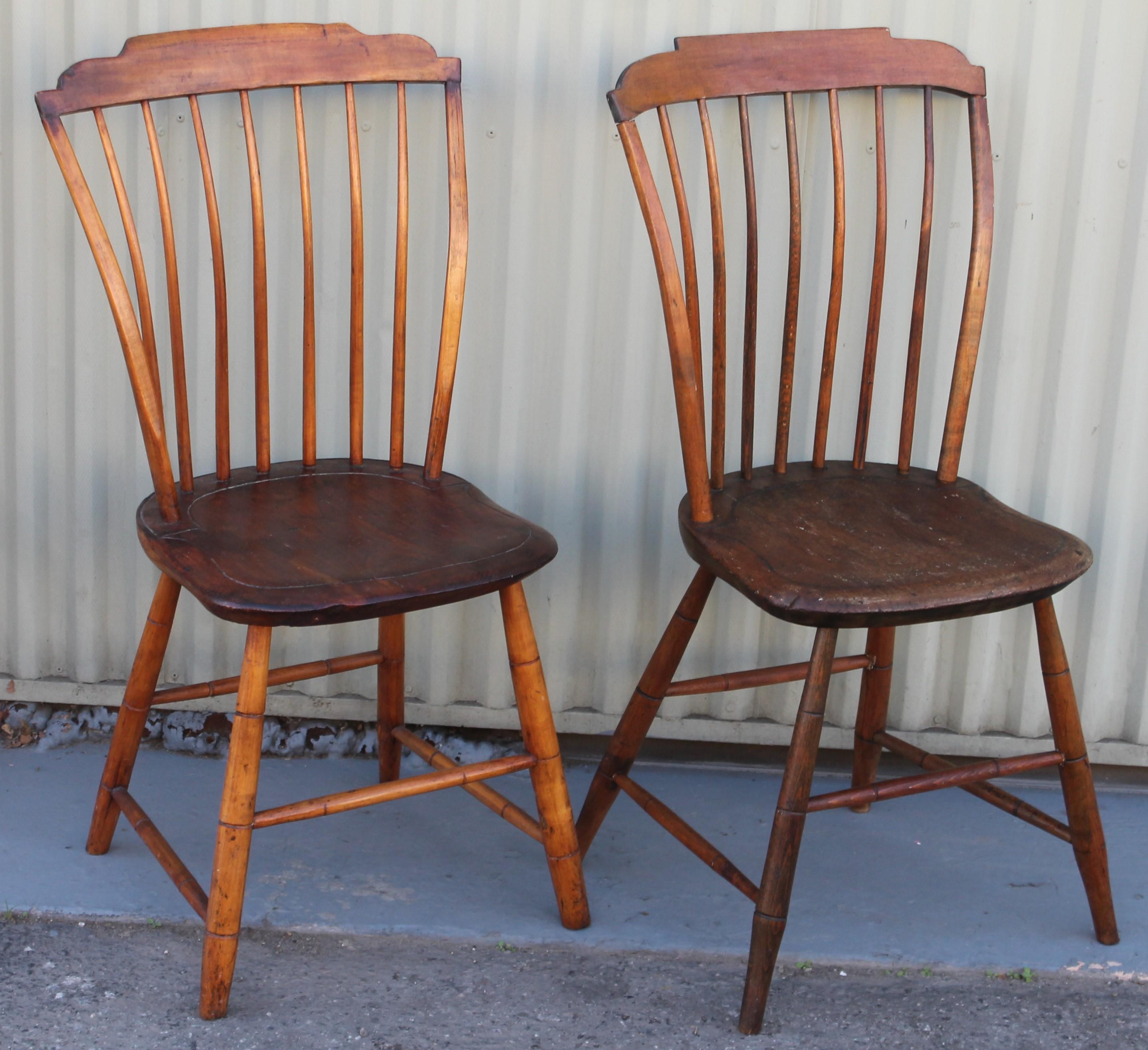 This fine pair of step down Windsor chairs are in fine condition. One chair is signed underneath the seat. Both chairs are sturdy and comfortable.