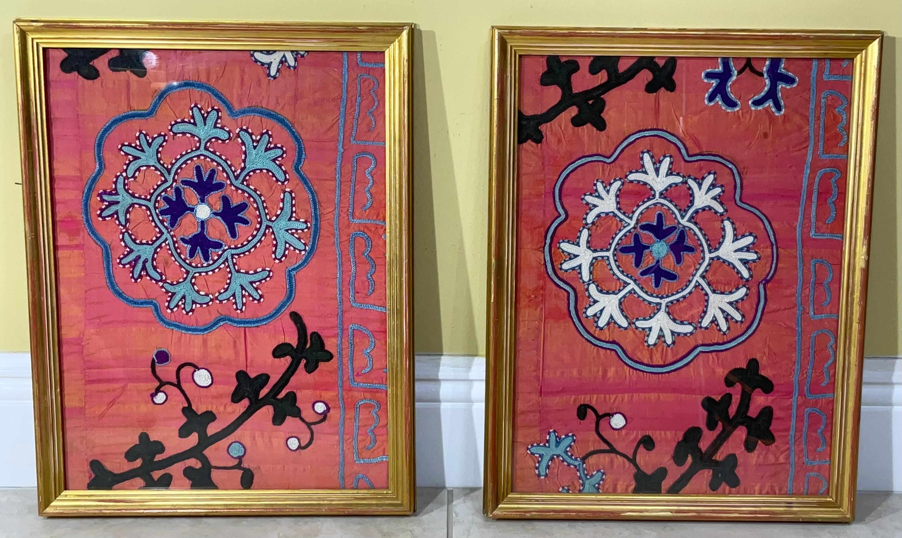 Beautiful pair of wall handing made of silk hand embroidery on pink silk background Suzani textile , floral and vine motif , professionally mounted on cotton backing . Quality wood frame .
backing sewn together by hand, framed with front glass, to