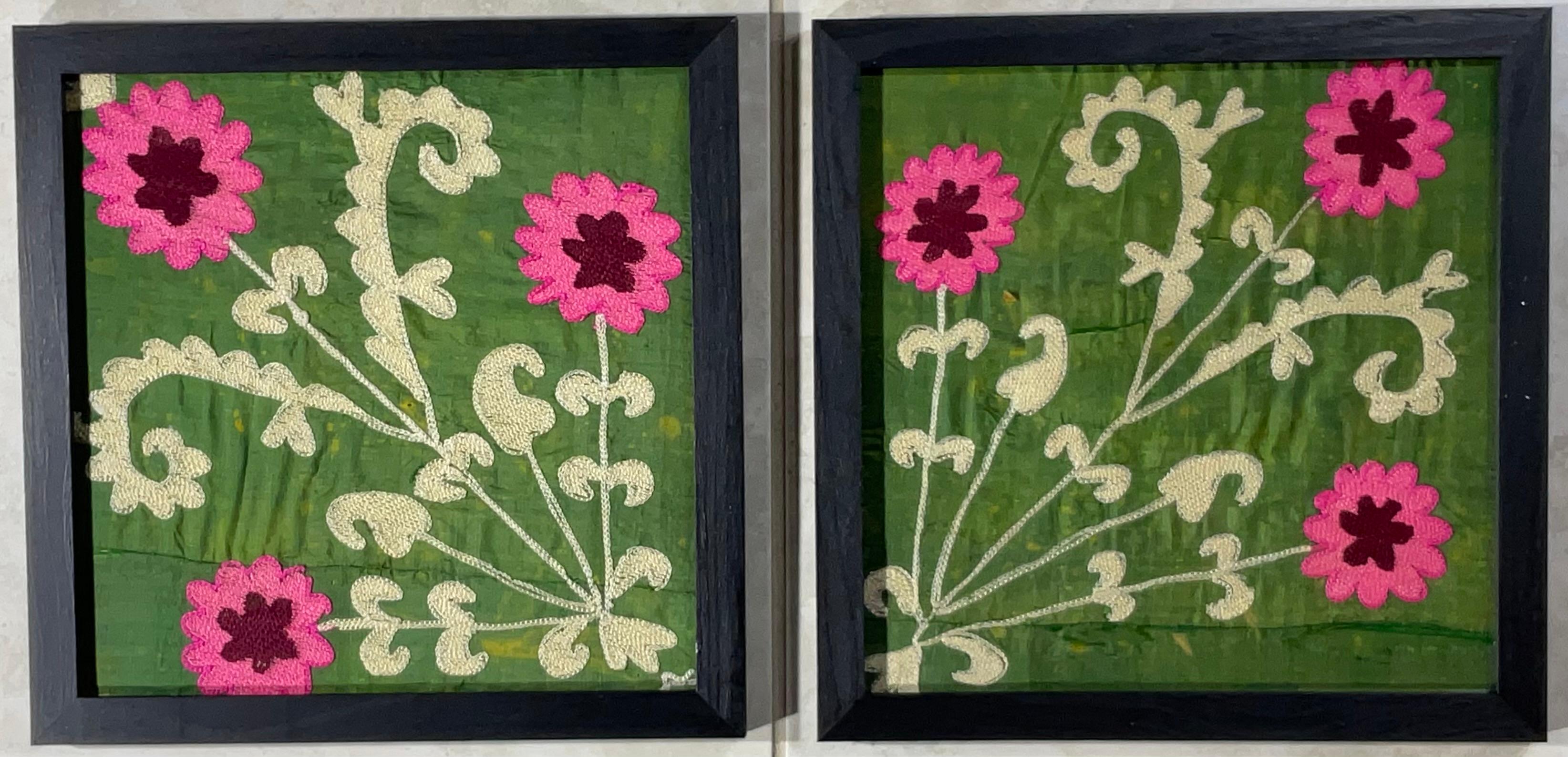 
This beautiful pair of Suzani embroidery features intricate geometric and floral patterns, showcasing traditional Uzbek craftsmanship. The vibrant green and pink colors and tight silk stitching on silk background suggest good quality. The