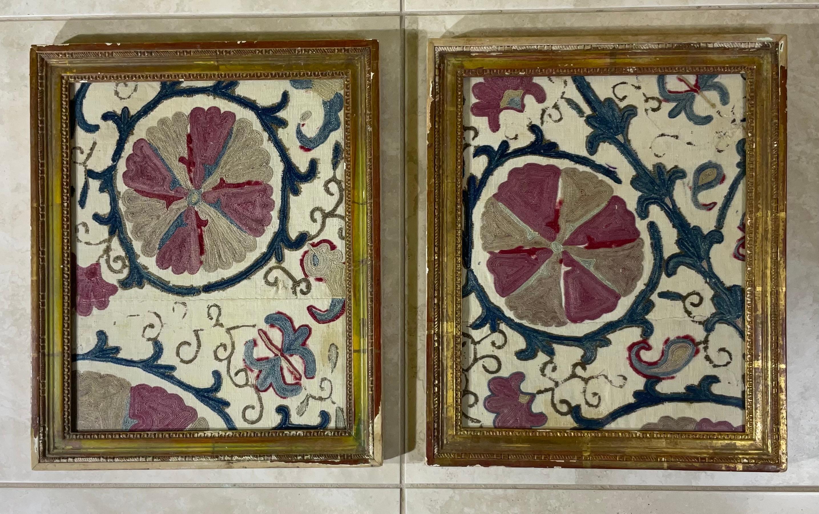 Exceptional antique hand embroidery fragments of Suzani textile, professionally mounted on pair of solid  wood antique Italian frames, to make beautiful versatile objects of art for wall hanging.
Even though these hand made fragments are almost