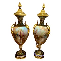 Antique Pair of 19 th c. French urns in the Sevres style with champleve accents