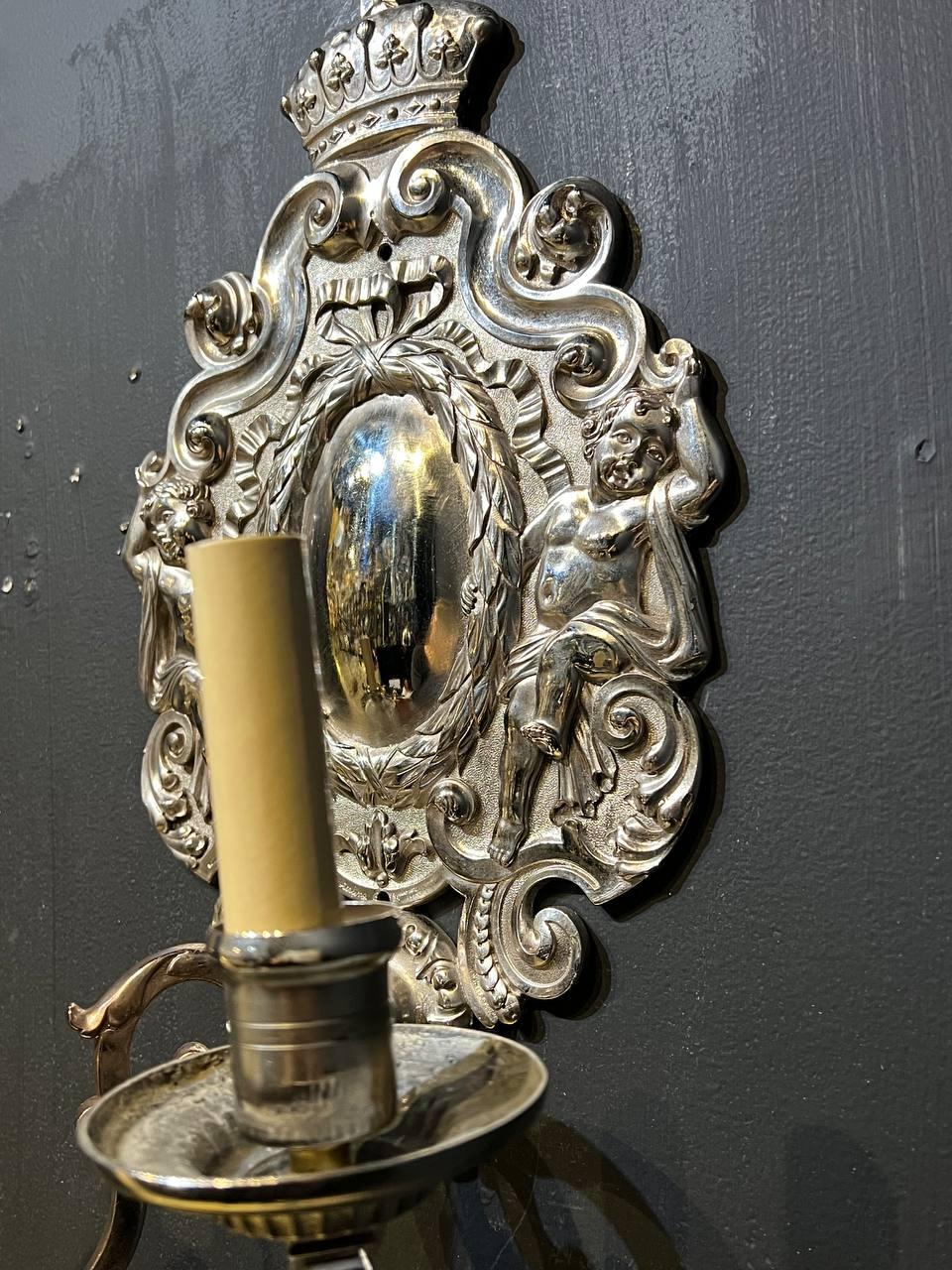 Pair of 1900's Caldwell Silver Plated Sconces with Cherubs In Good Condition For Sale In New York, NY