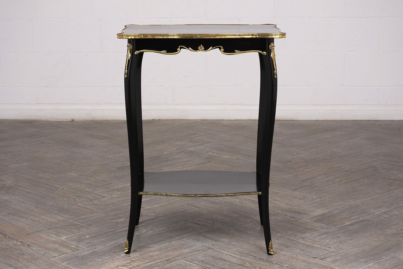 Lovely pair of side tables. Made from solid mahogany wood, with new rich ebonized finish. Solid wood top with a brass trim, and lovely brass decorations on the sides, and corners. Features a bottom open shelve with brass design trims. Finished with